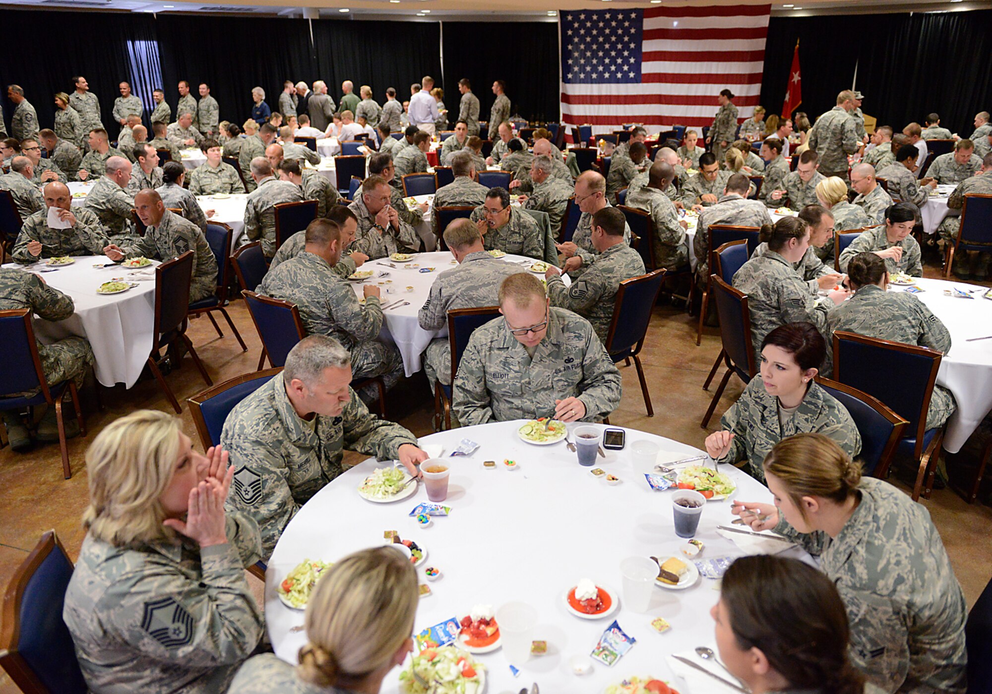 Members of the 138th Fighter Wing and Special Guests enjoy lunch during a luncheon and ceremony at the 138th Fighter Wing, Tulsa Air National Guard, April 6, 2014.  The luncheon and award ceremony was held to honor the 2013 Outstanding Airman of the Year for the 138th FW.   (U.S. National Guard photo by Master Sgt.  Mark A. Moore/Released)