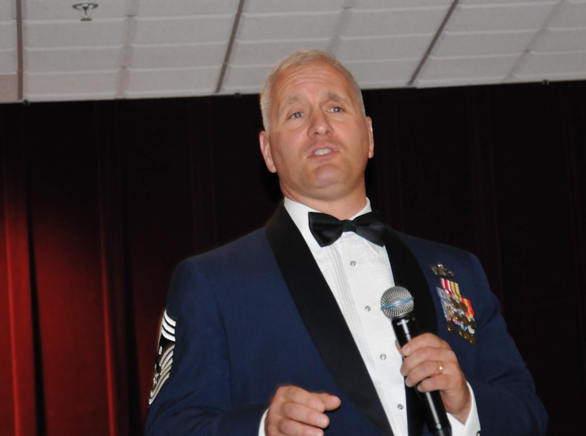 Chief Master Sgt. Michael Bellerose, Air Force Reserve Command's first sergeant functional manager, shares words of encouragement and support for the 512th Airlift Wing's newest senior noncommissioned officers during an induction ceremony April 5, 2014, at the Delaware Technical Community College Conference Center, Dover, Del. Among other duties, Bellerose is responsible for advising AFRC on the training and utilization of 509 assigned first sergeants. (U.S. Air Force photo/Senior Airman Joe Yanik)