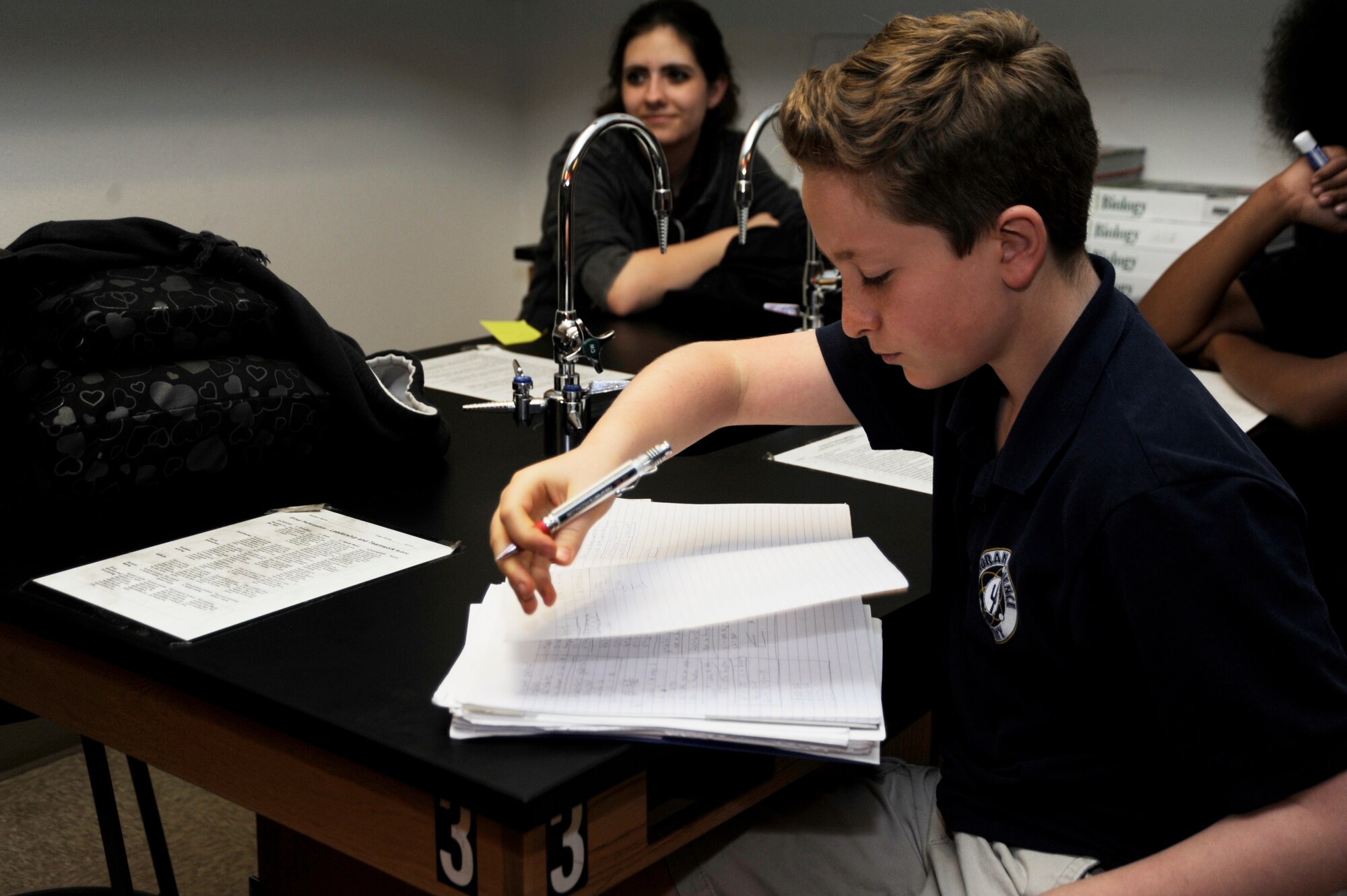 David Zulli, son of U.S. Air Force Lt. Col. Daniel Zulli, 355th Fighter Wing base chaplain, reviews notes in his class at Davis-Monthan Air Force Base, Ariz., April 4, 2014. David was recently selected as the Boys and Girls Club of America Arizona Military Youth of the Year. (U.S. Air Force photo by Airman 1st Class Betty R. Chevalier/released)