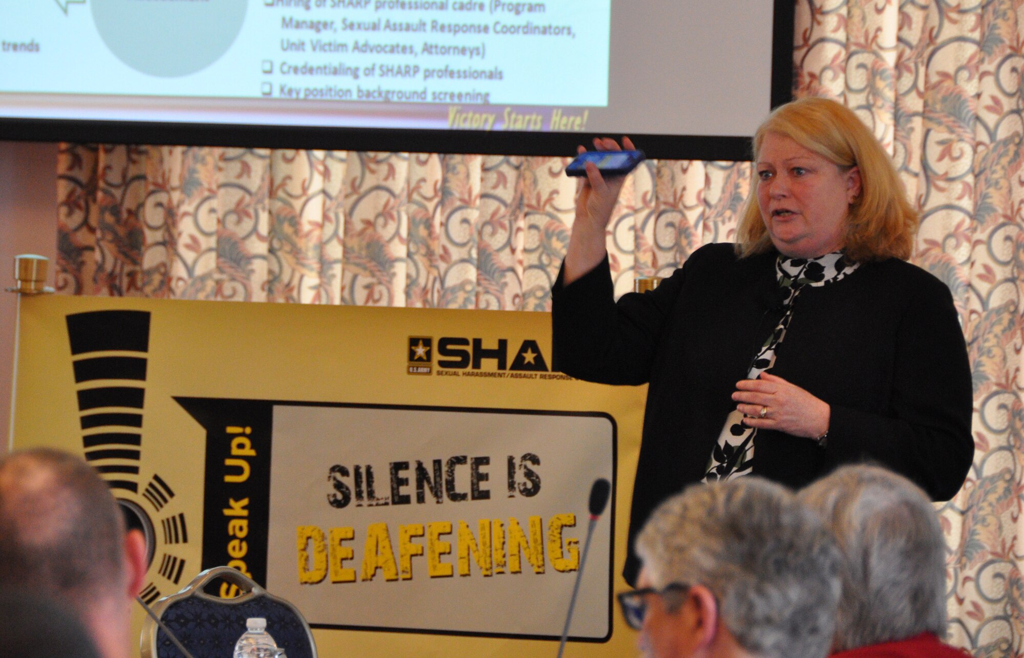 Ellen Helmerson, U.S. Army Training and Doctrine Command G-1/4 deputy chief of staff, discusses an app that's part of the command's sexual harassment/assault response prevention efforts, during the Army Education Advisory Committee roundtable discussion session at the Fort Eustis Club at Fort Eustis, Va., April 3, 2014. (U.S. Army photo by Amy L. Haviland/Released)