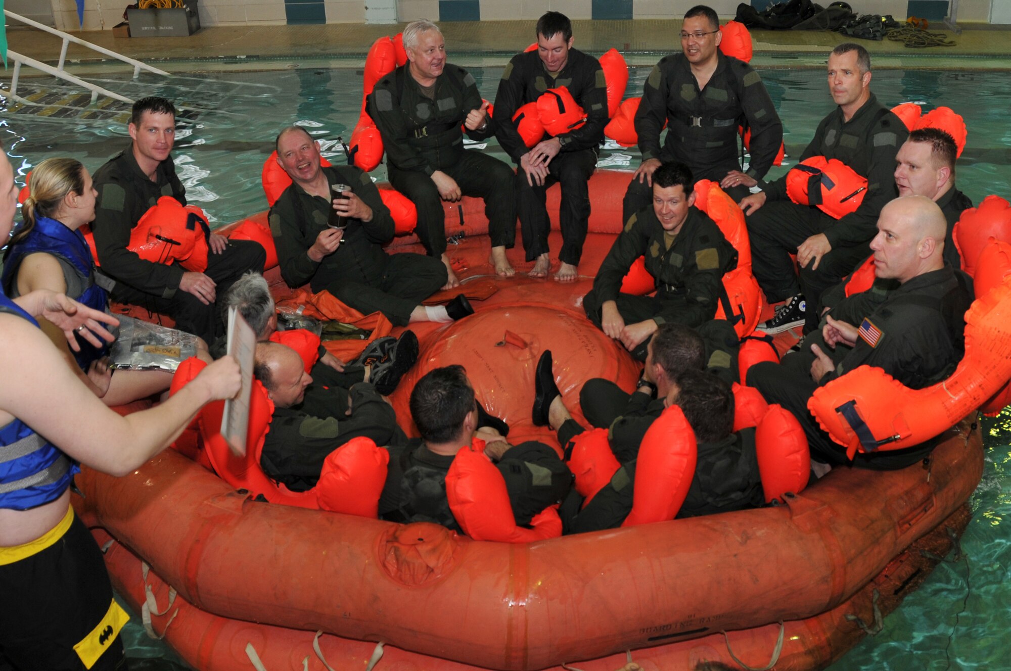 Members of the 164th Airlift Squadron perform water survival training at the Galion YMCA, April 6, 2014, Galion, OH. The C130 Hercules aircrew members are required to stay current in survival tactics and procedures on both land and water. (U.S. Air National Guard Photo by TSgt Joseph Harwood \Released)