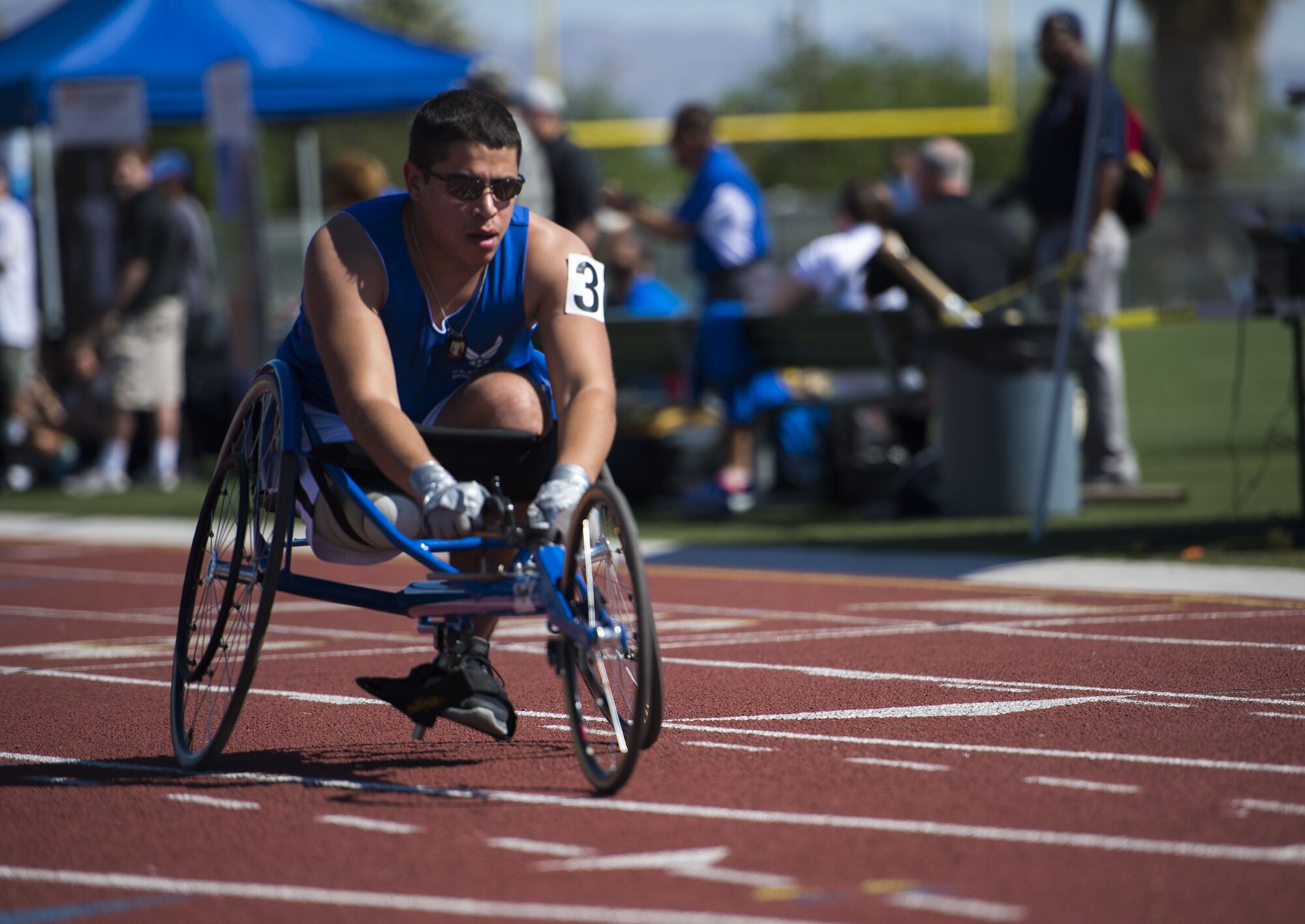 Staff Sgt. Mark Johnson raced in a sprinting wheelchair during the track and field portion of the Air Force Trials on April 8, 2014, at Rancho High School in Las Vegas, Nev. The Air Force Trials give injured, ill and wounded Airmen a chance to compete in Paralympic-style events. (U.S. Air Force photo/Senior Airman Jette Carr)