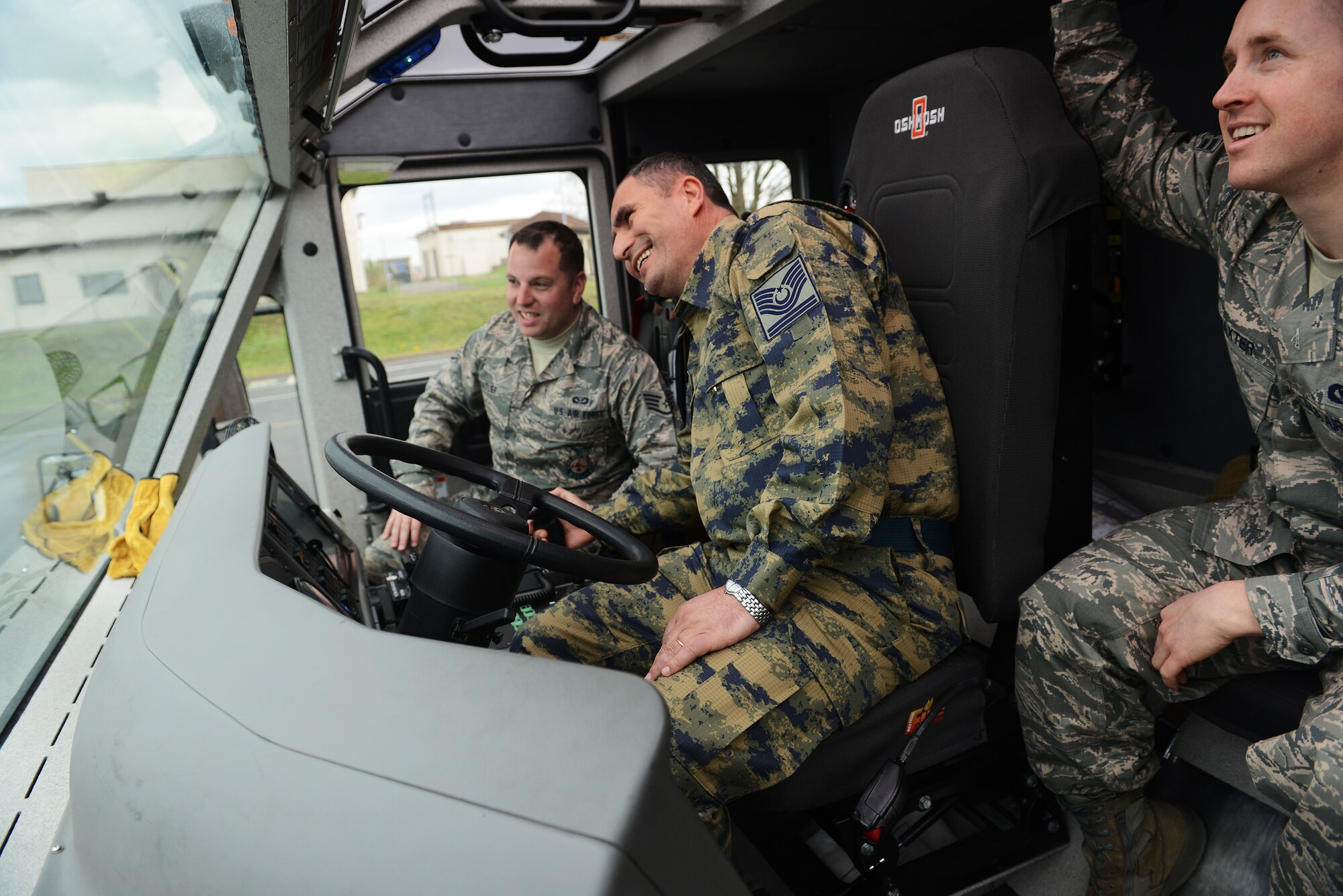 Chief Master Sergeant of the Turkish Air Force, Nazmi Harmanci, learns how to operate the water hose in a fire truck during a visit to the fire department April 8, 2014 at Ramstein Air Base, Germany. Harmanci’s first visit to Ramstein focused on seeing the enlisted Airmen and the programs they support as well as the professional military education they receive. (U.S. Air Force photo/ Staff Sgt. Ryan Crane)