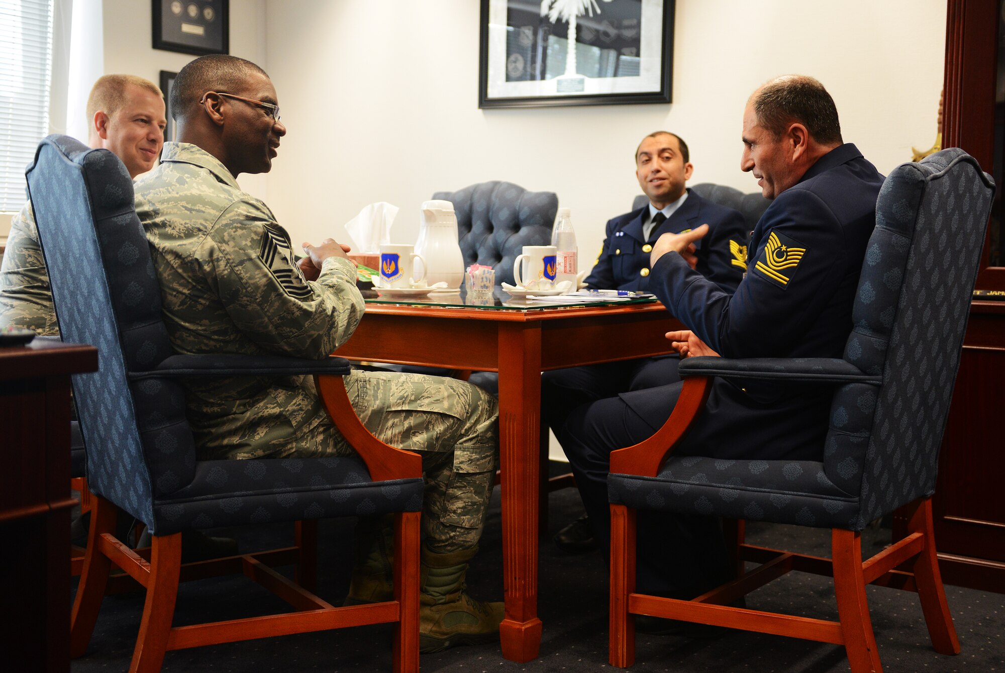 Chief Master Sgt. James E. Davis (left), U.S. Air Forces in Europe and Air Force Africa command chief, speaks with Chief Master Sergeant of the Turkish Air Force, Nazmi Harmanci (right), about the USAFE-AFAFRICA mission statement, “Forward, Ready, Now!”, during a meeting April 7, 2014 at Ramstein Air Base, Germany. Harmanci’s first visit to Ramstein focused on seeing the enlisted Airmen and the programs they support as well as the professional military education they receive. (U.S. Air Force photo/ Staff Sgt. Ryan Crane)
