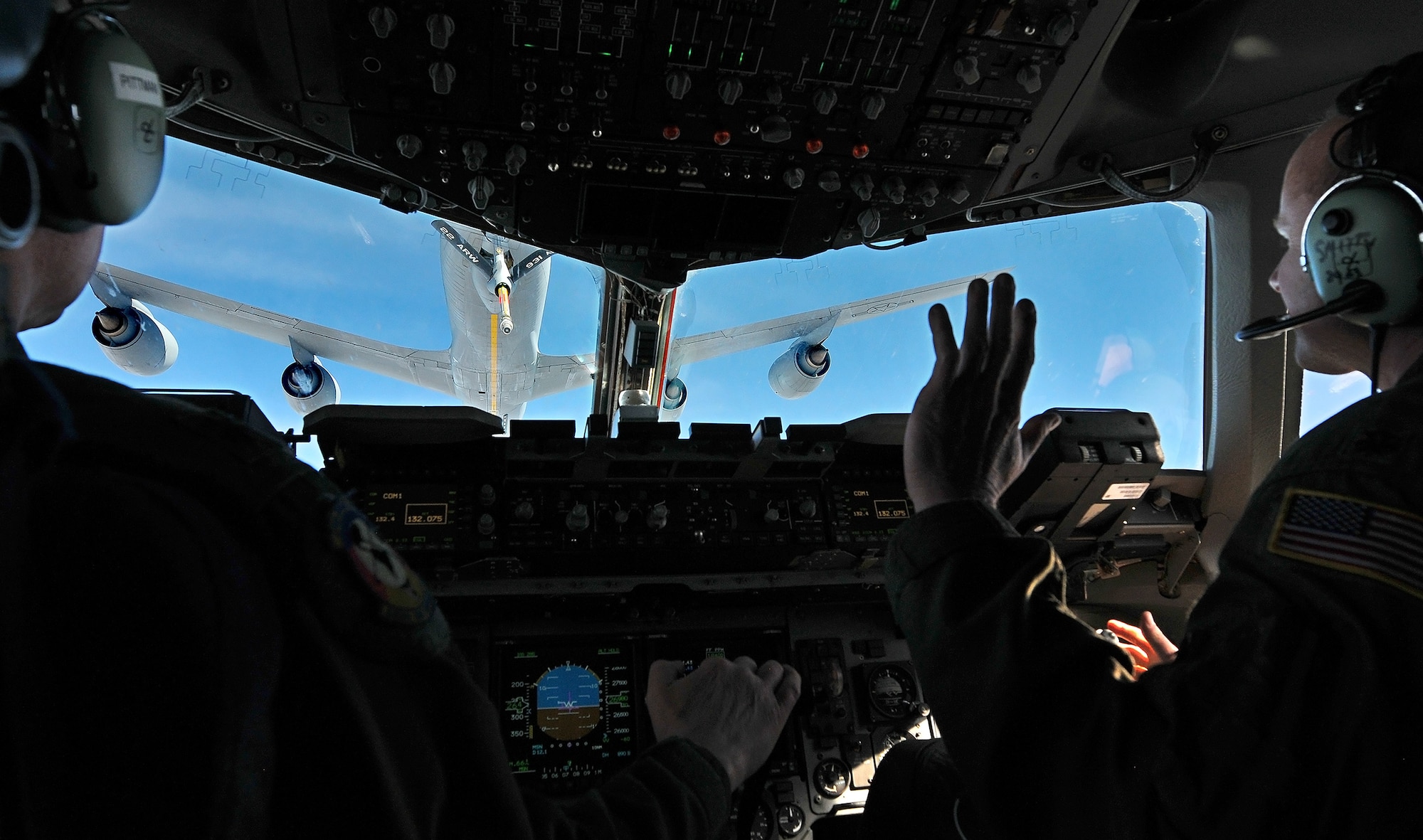 WRIGHT-PATTERSON AIR FORCE BASE, Ohio - Lt. Col. Clay Pittman and Maj. John Smith, 89th Airlift Squadron C-17 Globemaster III pilots, conduct air refueling currency training over Texas with a KC-135 Stratotanker from the 18th Air Refueling Squadron, 931st  Air Refueling Group, McConnell Air Force Base, Kan., Feb. 23 while en route to Wright-Patterson Air Force Base, Ohio. (U.S. Air Force photo/Tech. Sgt. Frank Oliver)  