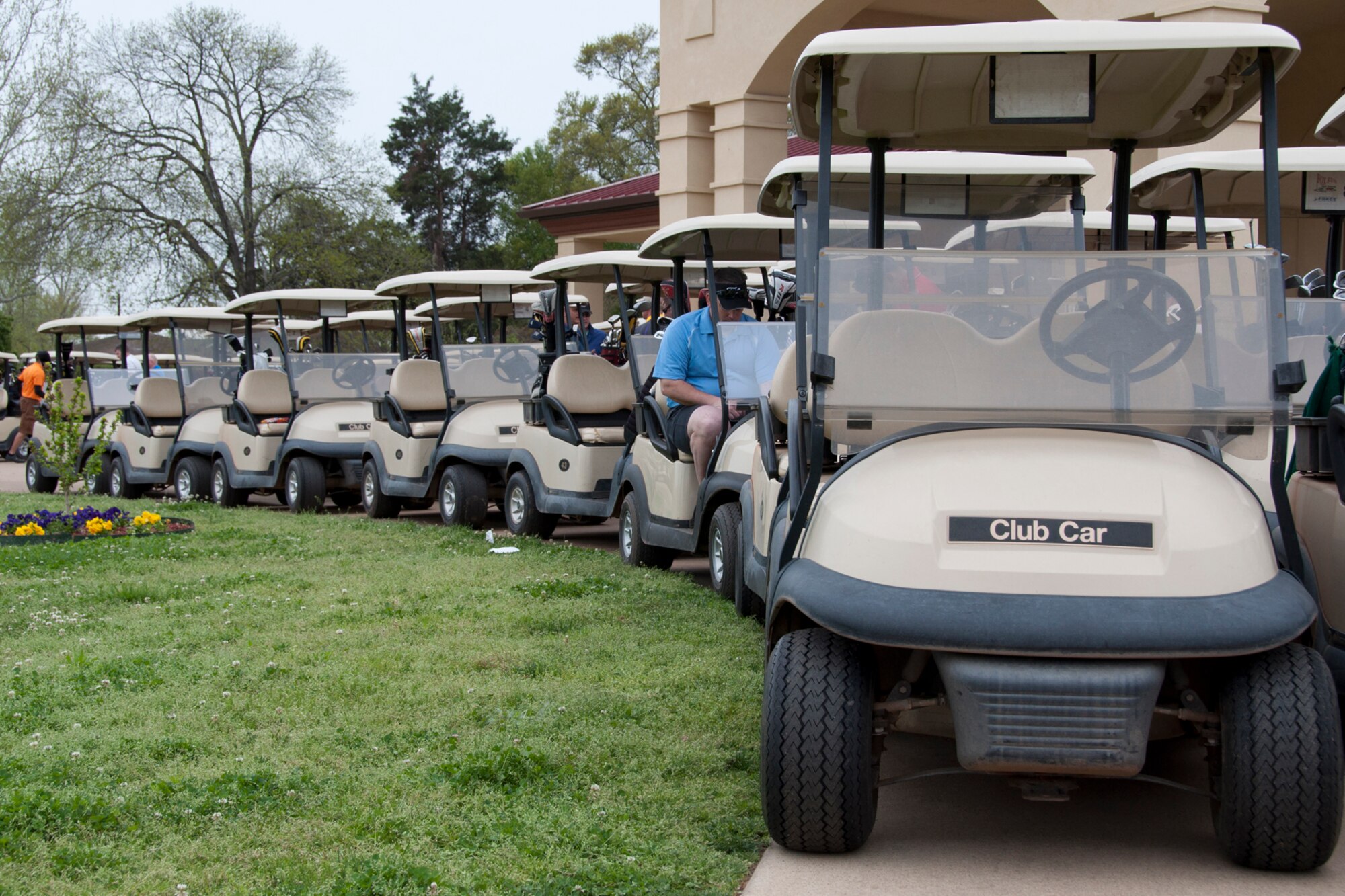 A row of golf carts stands at the ready prior to the start of the 307th Bomb Wing Commander's Cup Golf Tournament at Barksdale Air Force Base, La., April 5, 2014.   More than 19 teams took part in the annual event and is held in conjunction with family day activities for the wing. (U.S. Air Force photo by Tech. Sgt. Ted Daigle/Released)