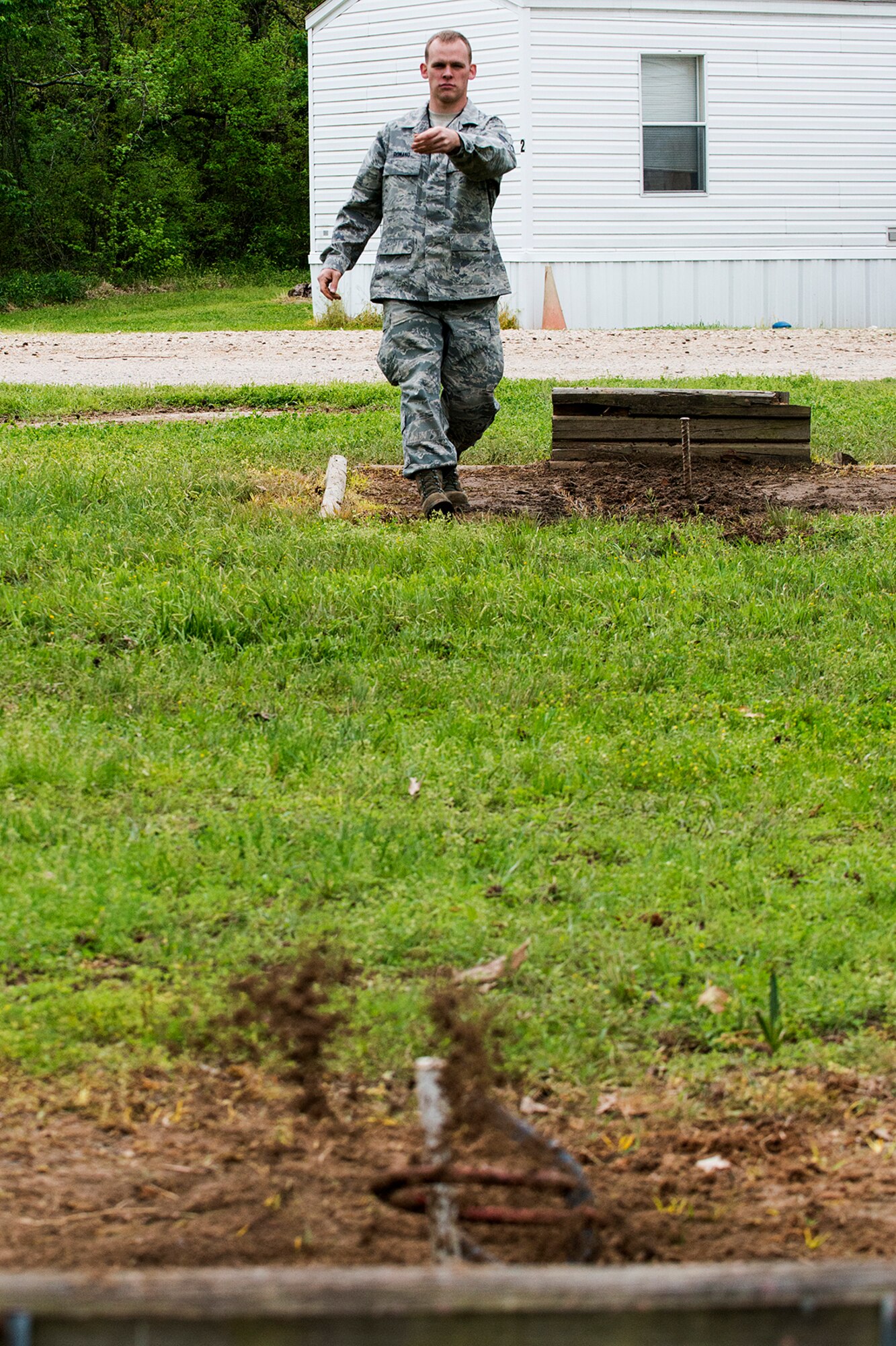 A member of the 307th Bomb Wing throws a ringer during a game of Horseshoes at Family Day, April 5, 2014, Barksdale Air Force Base, La. Family Day is an annual event that gives Airmen and their families the opportunity to build camaraderie and have fun. (U.S. Air Force photo by Master Sgt. Greg Steele/Released)