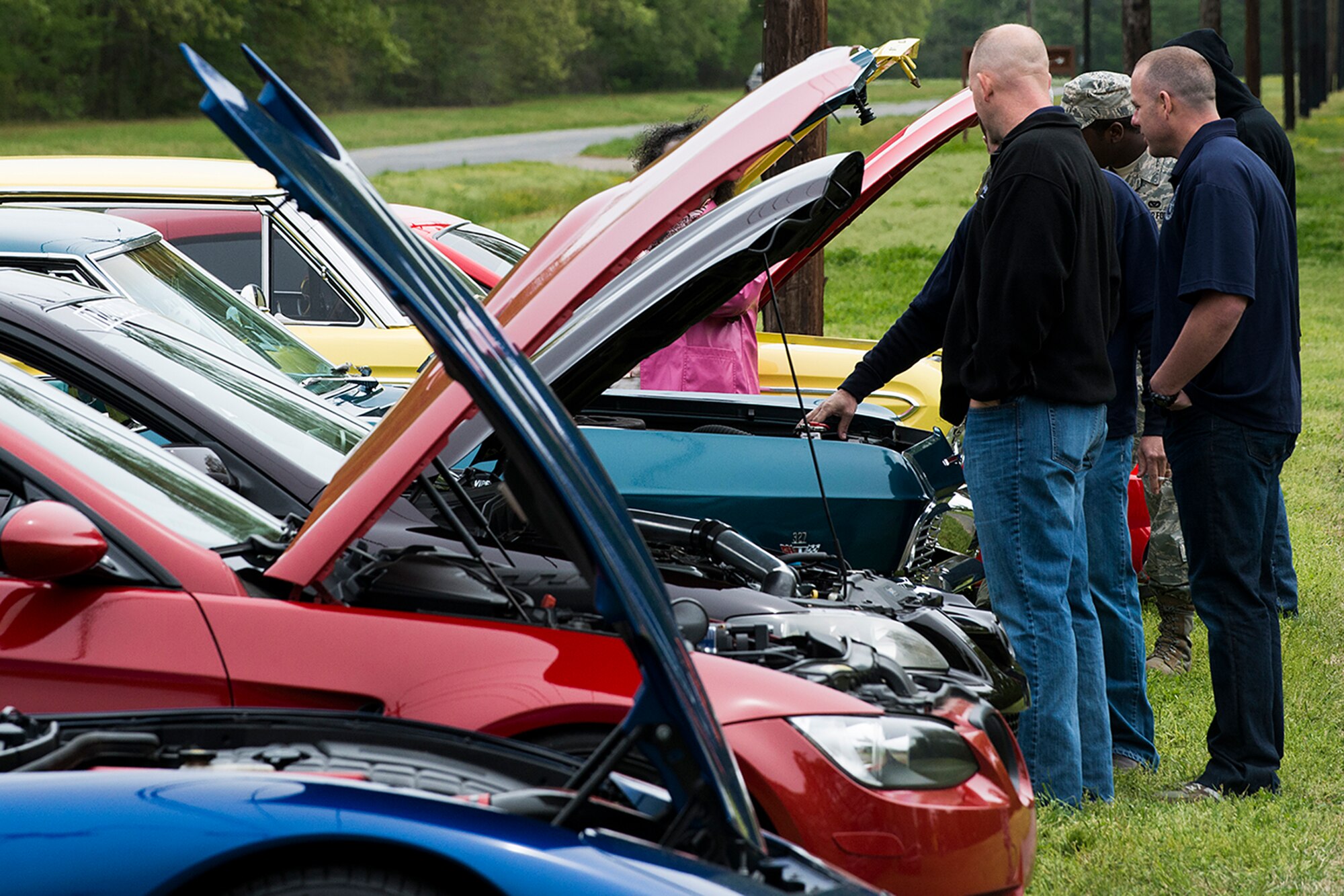 A car competition is held during the 307th Bomb Wing Family Day, April 5, 2014, Barksdale Air Force Base, La. Attendees of Family Day place votes for winners in different car categories to include Best of Show, Classic and New. (U.S. Air Force photo by Master Sgt. Greg Steele/Released)