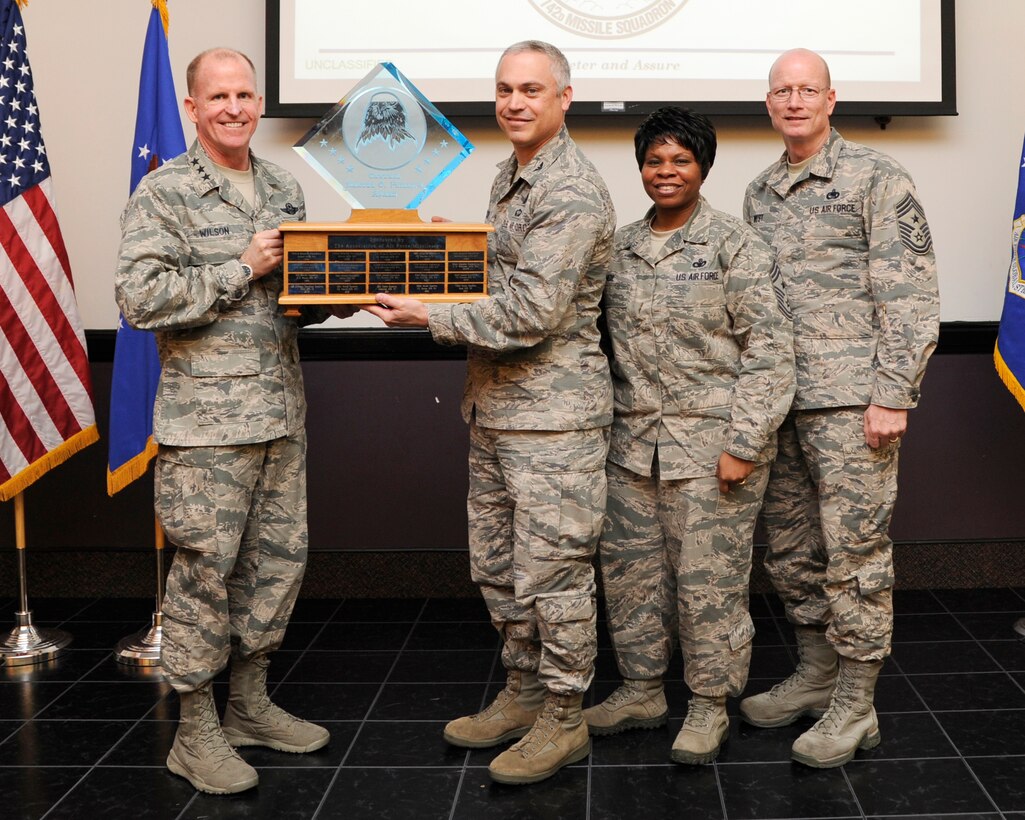 Lt. Gen. Stephen Wilson, Air Force Global Strike Command commander presents the Gen. Samuel C. Phillips Award for Best Overall Missile Squadron to Col. Robert Vercher, 91st Missile Wing commander during a ceremony at Barksdale Air Force Base, April 9. The award is presented annually to the wing recognized as the best in their field. (U.S. Air Force photo/Senior Airman Joseph A. Pagán Jr.)