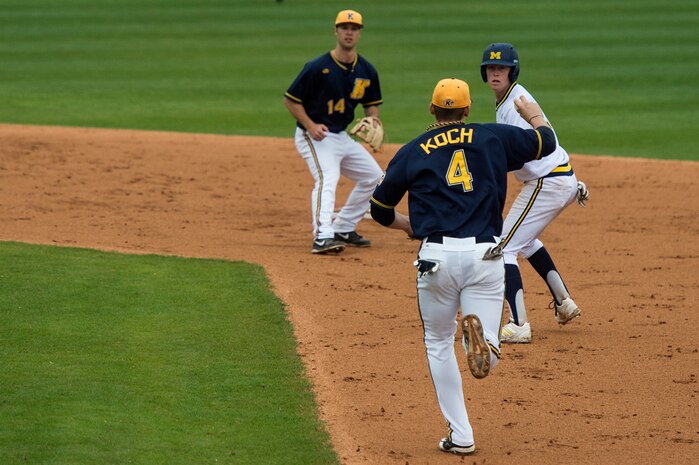University of Michigan infielder Jacob Cronenworth, gets caught in a rundown during a game against Kent State University at the College of Charleston Tournament March 16, 2014, in Charleston, S.C. The University of Michigan would go on to beat Kent State University 3-2.  (U.S. Air Force photo/Senior Airman James Richardson)