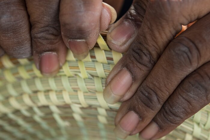 Charlene Haversham, along with her family, earn a living selling Sweetgrass baskets Feb. 22, 2014, in the Charleston Market, in Charleston, S.C. (U.S. Air Force photo/Airman 1st Class Logan Brandt)