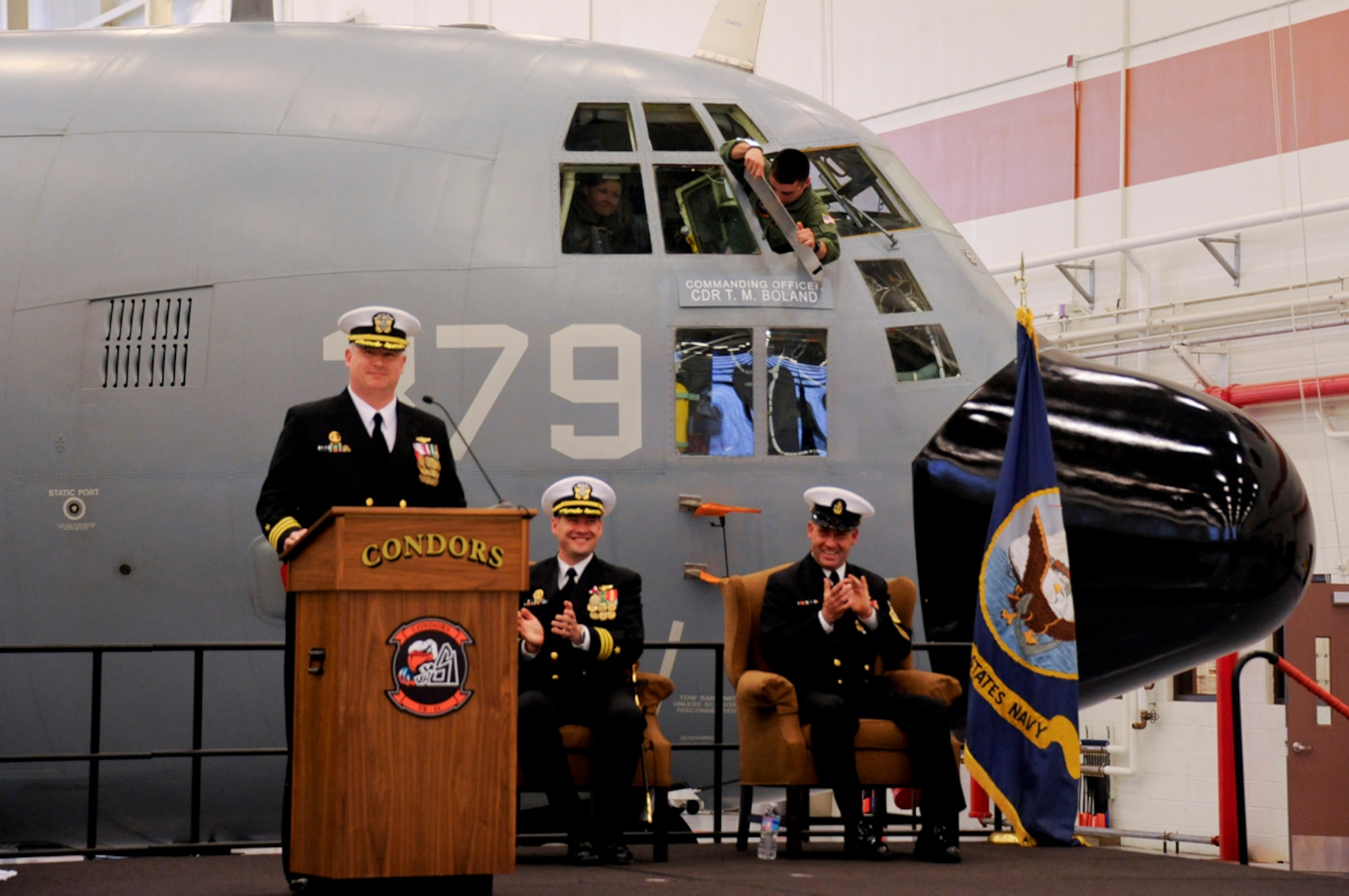 Cmdr. Todd M. Boland assumes command of the Fleet Logistics Support Squadron(VR-64) as his name is displayed on a unit C-130T Hercules during the squadron's change of command held at the VR-64 hangar April 5, 2014, Joint Base McGuire-Dix-Lakehurst, N.J. Boland will command the VR-64 Condors for the next 15 months. (U.S. Air Force photo by Airman 1st Class Tara A. Williamson/Released)