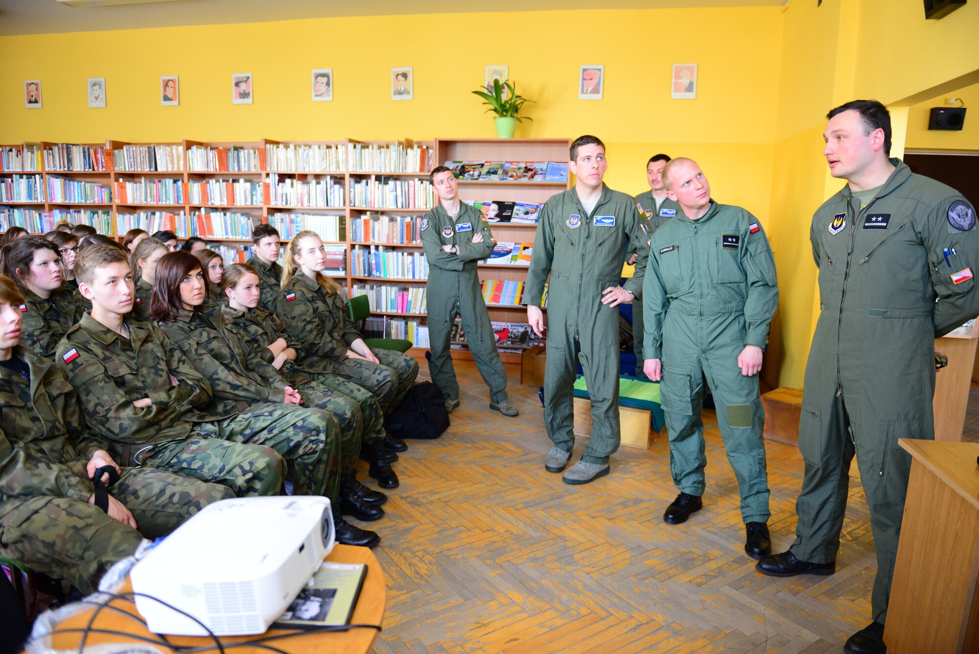Students at the Gen. Dr. Romana Abrahama Secondary School took part in a community engagement during the U.S. Aviation Detachment 14-2 rotation, Powidz Air Base, Poland, April 4, 2014.  U.S. Air Force and Polish pilots briefed the local students about flying and the importance of a strong partnership between the two countries in Wrzesnia. The students are equivalent to high school U.S. Air Force Junior Reserve Officer Training Corps.  (U.S. Air Force photo/Tech. Sgt. Daylena S. Ricks)
