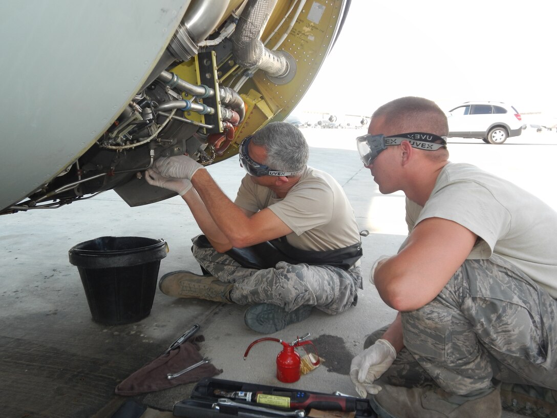 Wing commander works with aircraft maintainers