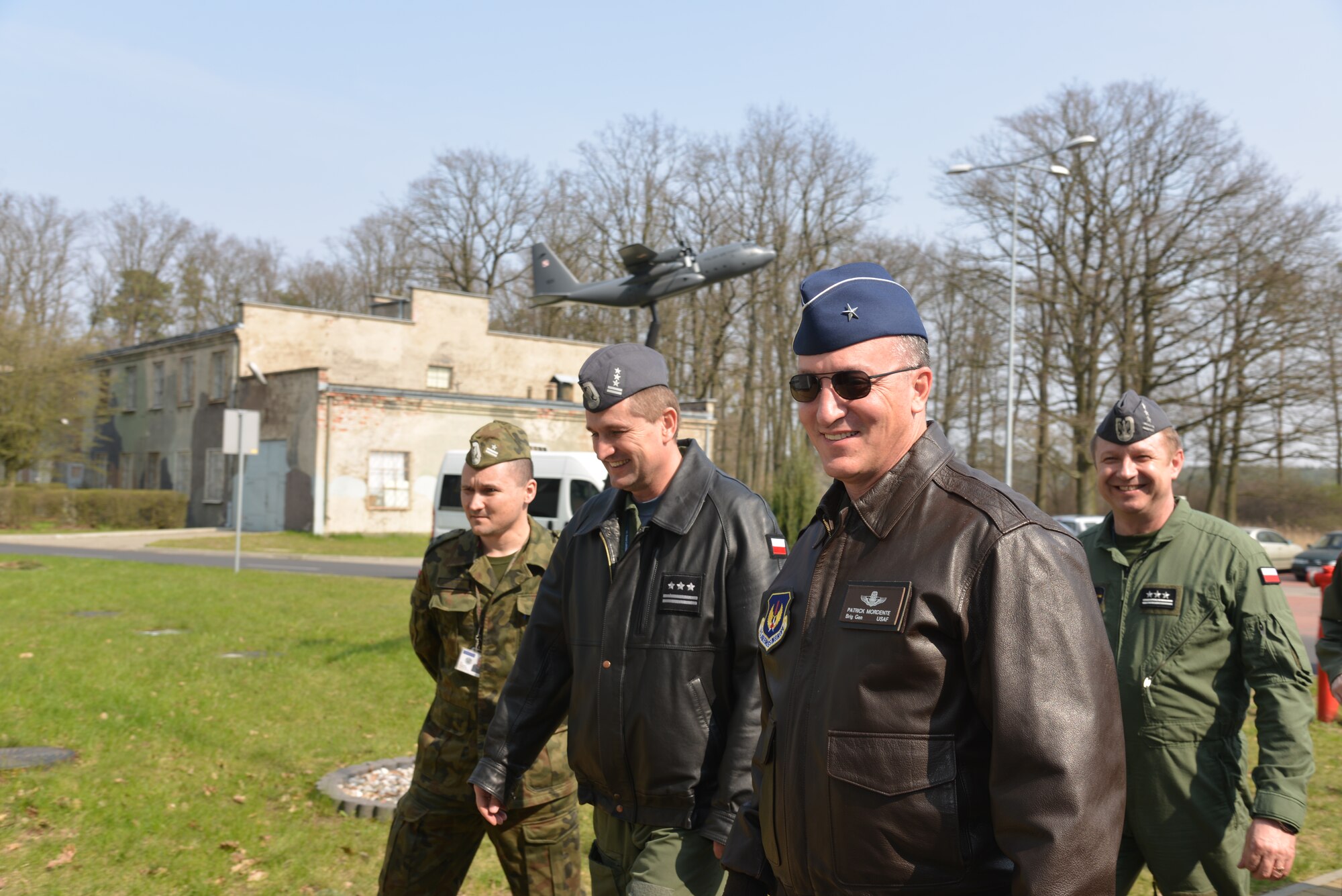 United States Brig. Gen. Patrick X. Mordente, 86th Airlift Wing commander, Ramstein Air Base, walks with Polish air force Col. Miroslaw Lusiarczyk, 33rd Air Base commander at Powidz Air Base, Poland,  on his first visit to the 86th AW's Polish sister wing, April 3, 2014. The Av-Det fosters partnership capacity with its strong NATO ally Poland to build bilateral defense ties. (U.S. Air Force photo by 2nd Lt. Katrina Cheesman/Released)