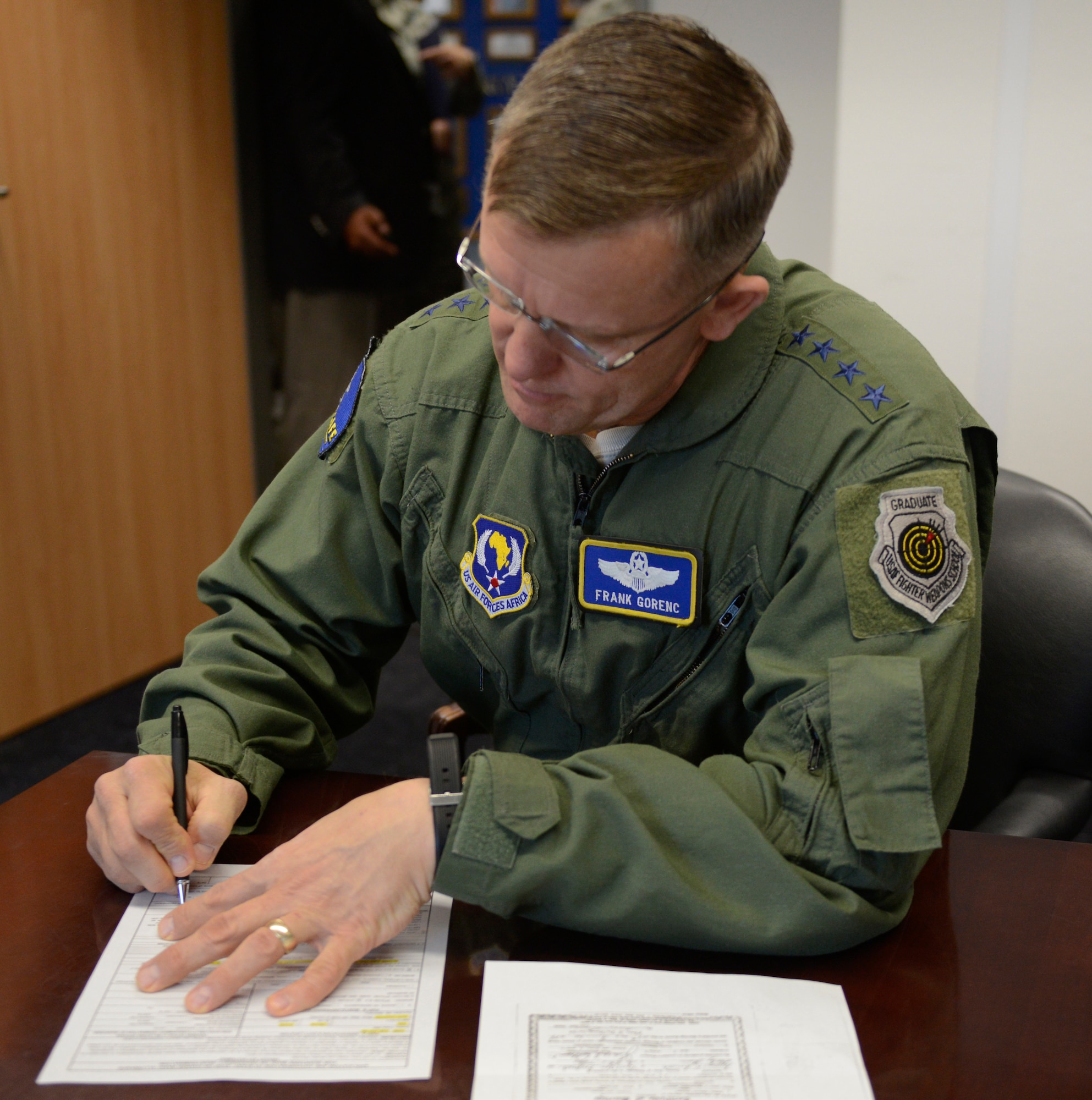 Gen. Frank Gorenc, U.S. Air Forces in Europe and Air Forces Africa
commander, completes his Air Force Form 549, Application and Authorization
to Start, Stop, or Change Basic Allowance for Quarter or Dependency
Determination, to revalidate his dependents April 10 inside USAFE-AFAFRICA
Headquarters here. The command's goal is to have all Airmen who must
revalidate dependents do so by Oct. 31. (U.S. Air Force photo by Tech. Sgt.
James M. Hodgman)
