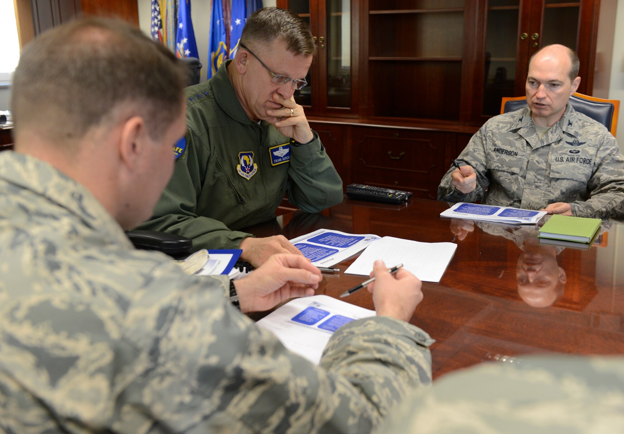 RAMSTEIN AIR BASE, Germany -- Gen. Frank Gorenc, U.S. Air Forces in Europe
and Air Forces Africa commander, listens to Col. William Anderson,
USAFE-AFAFRICA Innovation Transformation Office director, discuss the
command's plan for more than 16,000 Airmen to revalidate their dependents at
USAFE-AFAFRICA Headquarters here April 10. After the briefing, Gorenc
completed the form to revalidate his dependents personally. (U.S. Air Force
photo by Tech. Sgt. James M. Hodgman)
