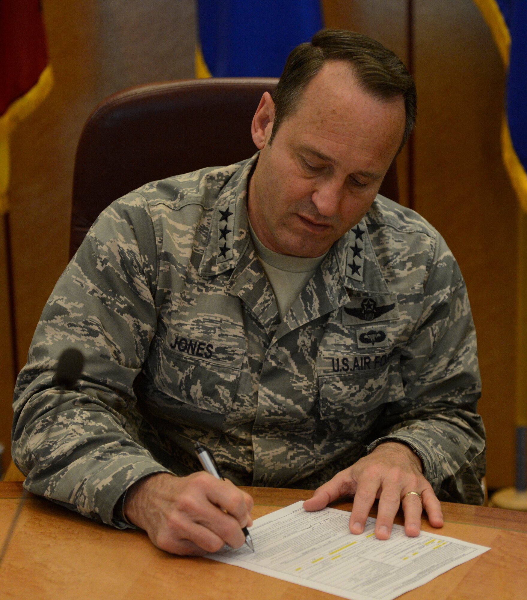 RAMSTEIN AIR BASE Germany -- Lt. Gen. Tom Jones, U.S. Air Forces in Europe
and Air Forces Africa vice commander, signs his Air Force Form 549, Application
and Authorization to Start, Stop, or Change Basic Allowance for Quarter or
Dependency Determination to revalidate his dependents in the Tunner
Conference Room here April 9. Prior to signing the form, Jones was briefed
on the USAFE-AFAFRICA plan for more than 16,000 Airmen across the command to
revalidate their dependents. All Airmen within the command must revalidate
their dependents by Dec. 31, 2014. (U.S. Air Force photo by Tech. Sgt. James
M. Hodgman)
