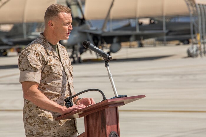 Col. Hunter Hobson, commanding officer of Marine Aircraft Group 12, gives his remarks of the new hangars and buildings during the MAG-12 and Marine Aviation Logistics Squadron 12 ribbon cutting ceremony aboard Marine Corps Air Station Iwakuni, Japan, March 27, 2014. 