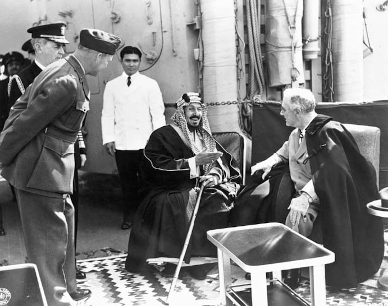 King Abdul Aziz of Saudi Arabia meets President Franklin D. Roosevelt aboard the USS Quincy Feb. 14, 1945. 