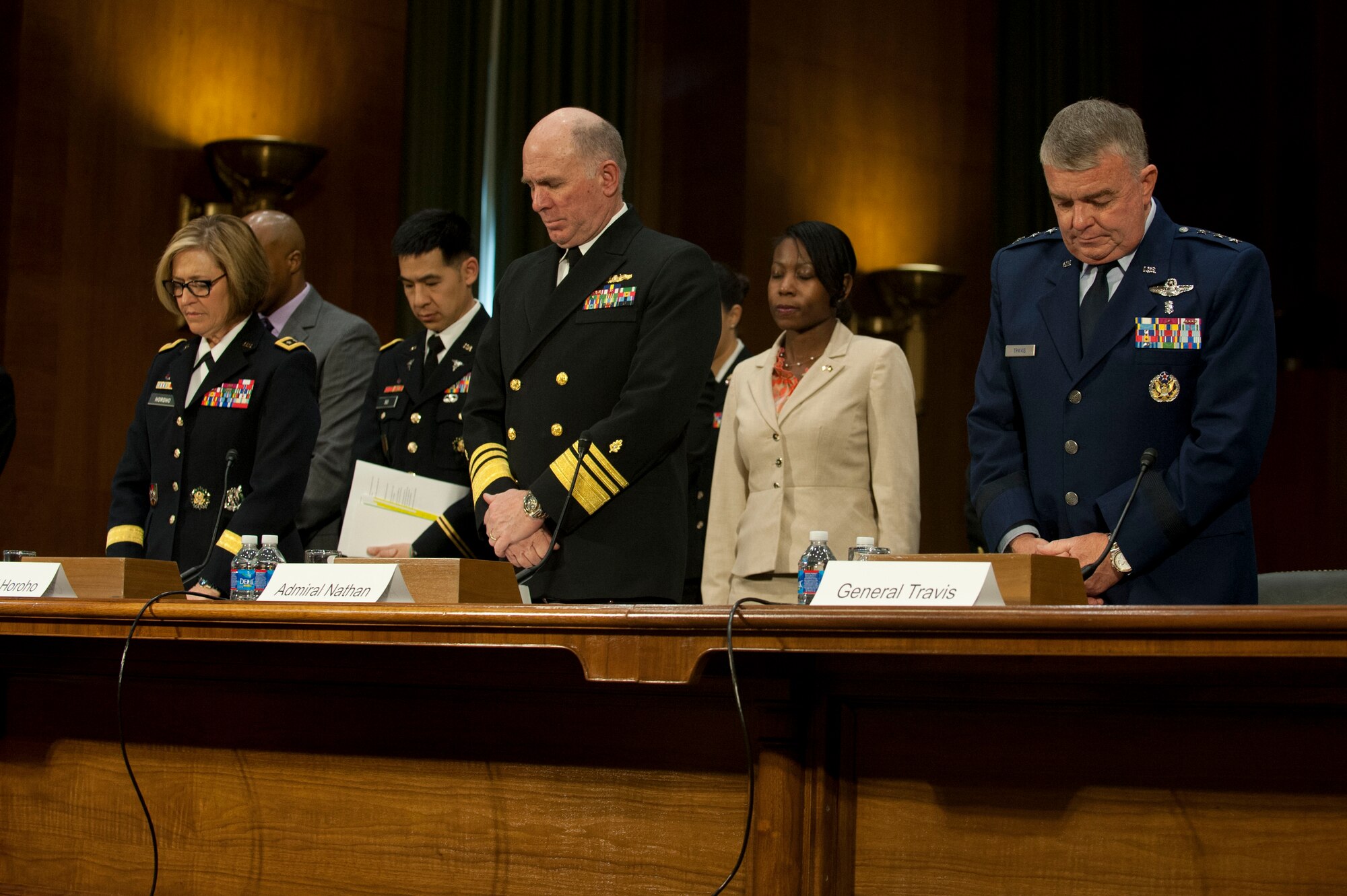 Lt. Gen. Patricia Horoho (left), Vice Adm. (Dr.) Matthew Nathan and Lt. Gen. (Dr.) Thomas Travis join in a moment of silence during a hearing with the Senate Appropriations Committee's subcommittee on defense, April 9, 2014, in Washington, D.C. The surgeons general of the Army, Navy and Air Force commemorated the victims of the Ft. Hood, Texas shooting. Horoho is the Army surgeon general, Nathan is the Navy surgeon general and Travis is the Air Force surgeon general. (U.S. Air Force photo/Staff Sgt. Carlin Leslie)



