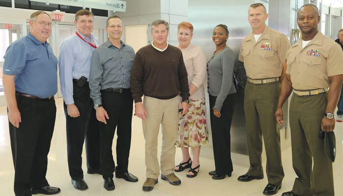 Harry Bailey (fourth from the left) contracting officer’s technical representative, Marine Corps Logistics Command (Forward), receives a welcome home by co-workers and friends, April 1, at the Southwest Georgia Regional Airport in Albany, Ga., after an eight-month deployment to Afghanistan. 