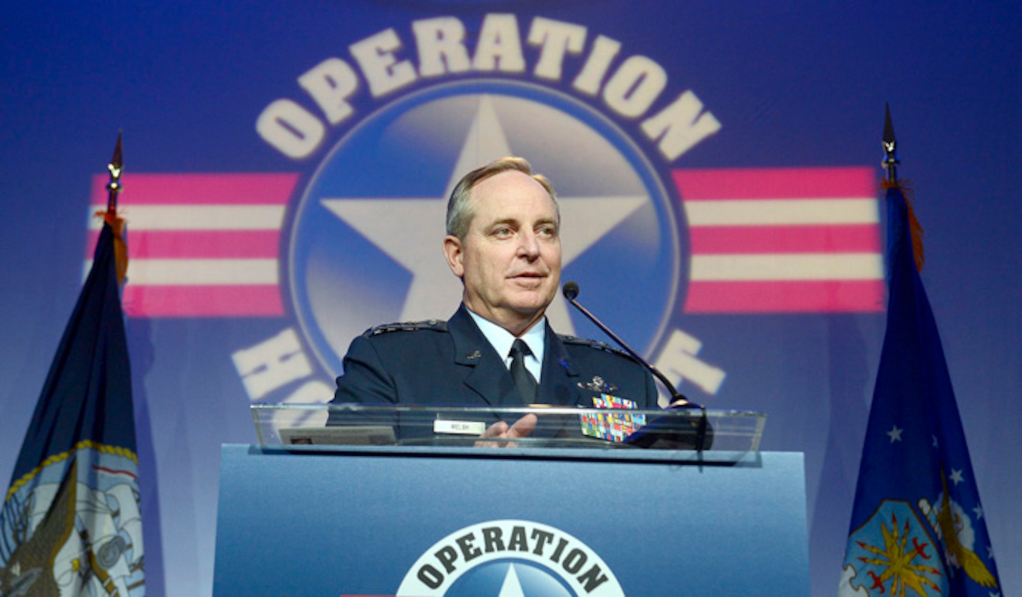 Air Force Chief of Staff Gen. Mark A. Welsh III talks about the Air Force recipient of the Military Child of the Year Award, Gage Dabin, son of Senior Master Sgt. Tobias Adam and mother, Jennifer, during the 6th annual gala hosted by Operation Homefront in Arlington, Va., April 10, 2014. The family is currently stationed at Joint Base Elmendorf-Richardson, Alaska. (U.S. Air Force photo/Scott M. Ash)