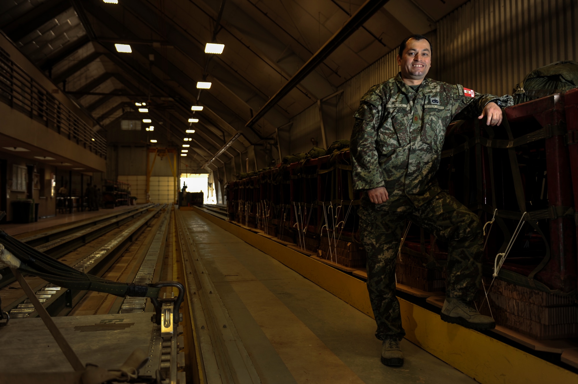 Maj. Jesus Saez of the Peruvian air force smiles for a photo at Little Rock Air Force Base, Ark. Saez is an international exchange officer currently serving as the commander of the Materiel Management flight with the 19th Logistics Readiness Squadron. During his exchange, Saez worked with his U.S. exchange counterpart, Maj. Paul Morris to improve communication between the two partner militaries. (U.S. Air Force photo/Airman 1st Class A1C Cliffton Dolezal) 