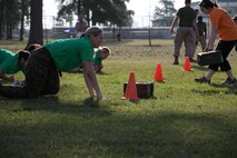 Carrie Colon, military spouse, gets up from a high-crawl during a modified Combat Fitness Test aboard Marine Corps Air Station New River, N.C., April 5, during an In Their Boots event. During the event, military spouses participated in multiple events that Marines do as training. 



