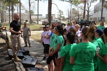 Spouses of Marines aboard Marine Corps Air Station New River listen to instruction on proper Marine Corps Martial Arts Program techniques aboard the air station, April 5. Spouses learned various defensive techniques during the In Their Boots event. 

