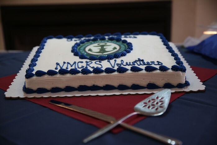 A cake is presented to show appreciation to the volunteers at the Navy-Marine Corps Relief Society's annual Volunteer Awards and Recognition Ceremony at the Officers Club aboard Marine Corps Air Station New River, April 7. The volunteers were presented with different awards based on how many hours they had volunteered. (U.S. Marine Corps photo by Lance Cpl. Andy J. Orozco/Released)


