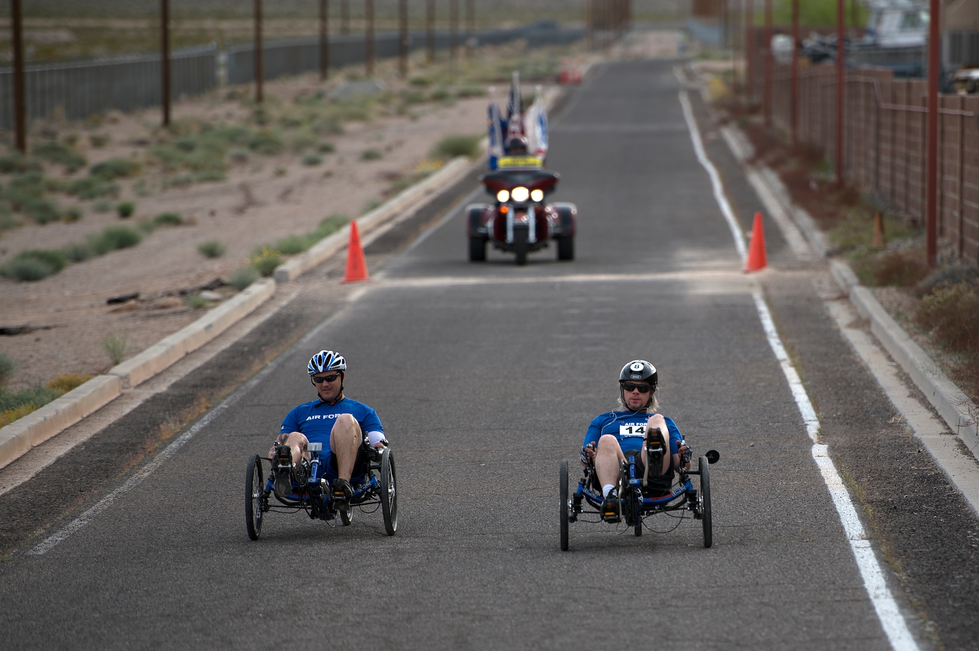 Athletes race to the finish during the men’s recumbent heat April 9, 2014, during the Air Force Trials at Nellis Air Force Base, Nev.  During the trials, injured, ill and wounded Airmen compete in Paralympic-type events to identify which members will be selected for the Warrior Games and Invictus Games teams.  (U.S. Air Force photo/Senior Airman Jette Carr)