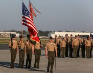 Sgt. Robert A. Allen III, commander of troops and motor transportation specialist with Marine Wing Support Squadron 272, marches the color guard to retire the colors during the Marine Corps Air Station New River relief and appointment and retirement ceremony for Sgt. Maj. Robert A. Allen Jr. (outgoing) and Sgt. Maj. William H. Oldenburg aboard the air station, April 11. Allen relinquished his post as the air station sergeant major to Oldenburg. During the ceremony, noncommissioned officers held key billets during the ceremony and marched with the noncommissioned officer sword. Sgt. Allen is the son of Sgt. Maj. Allen. 