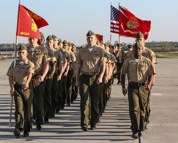 Marines from Marine Corps Air Station New River march the pass and review portion of the relief and appointment and retirement ceremony for Sgt. Maj. Robert A. Allen Jr., outgoing, and Sgt. Maj. William H. Oldenburg (incoming), April 11. Allen relinquished his post as the air station sergeant major to Oldenburg. During the ceremony, noncommissioned officers held key billets during the ceremony and marched with the noncommissioned officer sword. Sgt. Maj. Allen’s son, Sgt. Robert A. Allen III, a motor transportation specialist with Marine Wing Support Squadron 272, was the commander of troops for the ceremony.