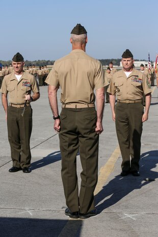 Sergeants Maj. Robert A. Allen Jr., left, and William H. Oldenburg, right, report to Col. Timothy M. Salmon, Marine Corps Air Station New River commanding officer, during a relief and appointment and retirement ceremony held aboard MCAS New River, April 11. Allen relinquished his post as the air station sergeant major to Oldenburg. During the ceremony, noncommissioned officers held key billets during the ceremony and marched with the noncommissioned officer sword. Sgt. Maj. Allen’s son, Sgt. Robert A. Allen III, a motor transportation specialist with Marine Wing Support Squadron 272, was the commander of troops for the ceremony.