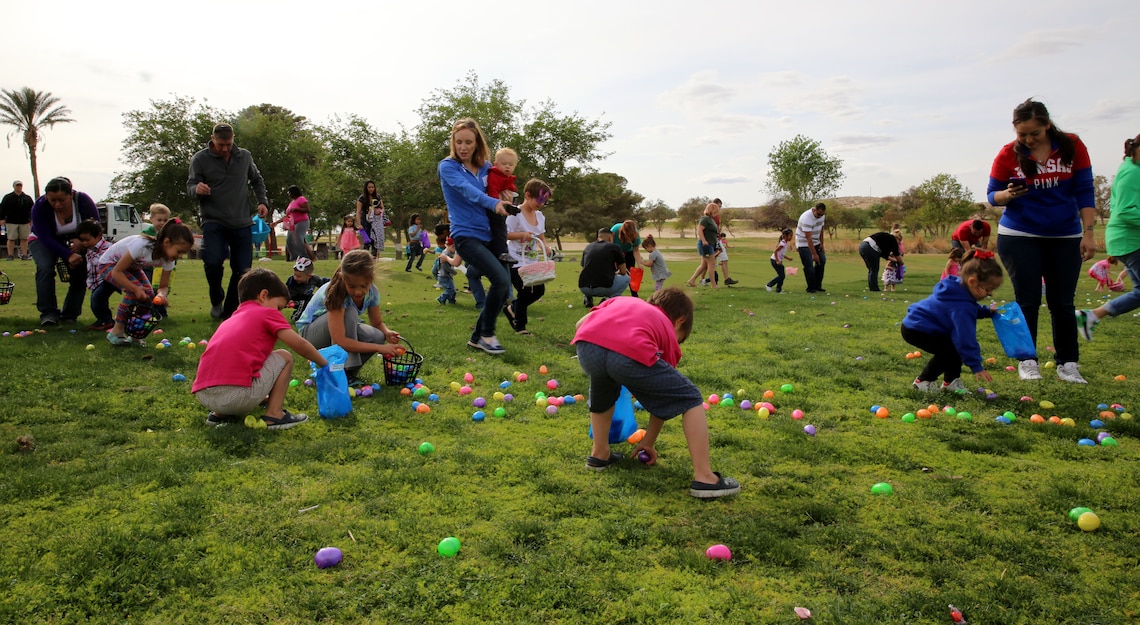 Children and spouses of Headquarters Battalion Marines participate in an Easter egg hunt during the HQBN Hippity Hoppity Family Day event at Desert Winds Golf Course, Friday. The family day concluded with various prize giveaways for the Marines and their family members. Prizes included sporting equipment, children’s games, kitchen appliances and a video game system. (Official Marine Corps Photo By Lance Cpl. Kasey Peacock/Released)