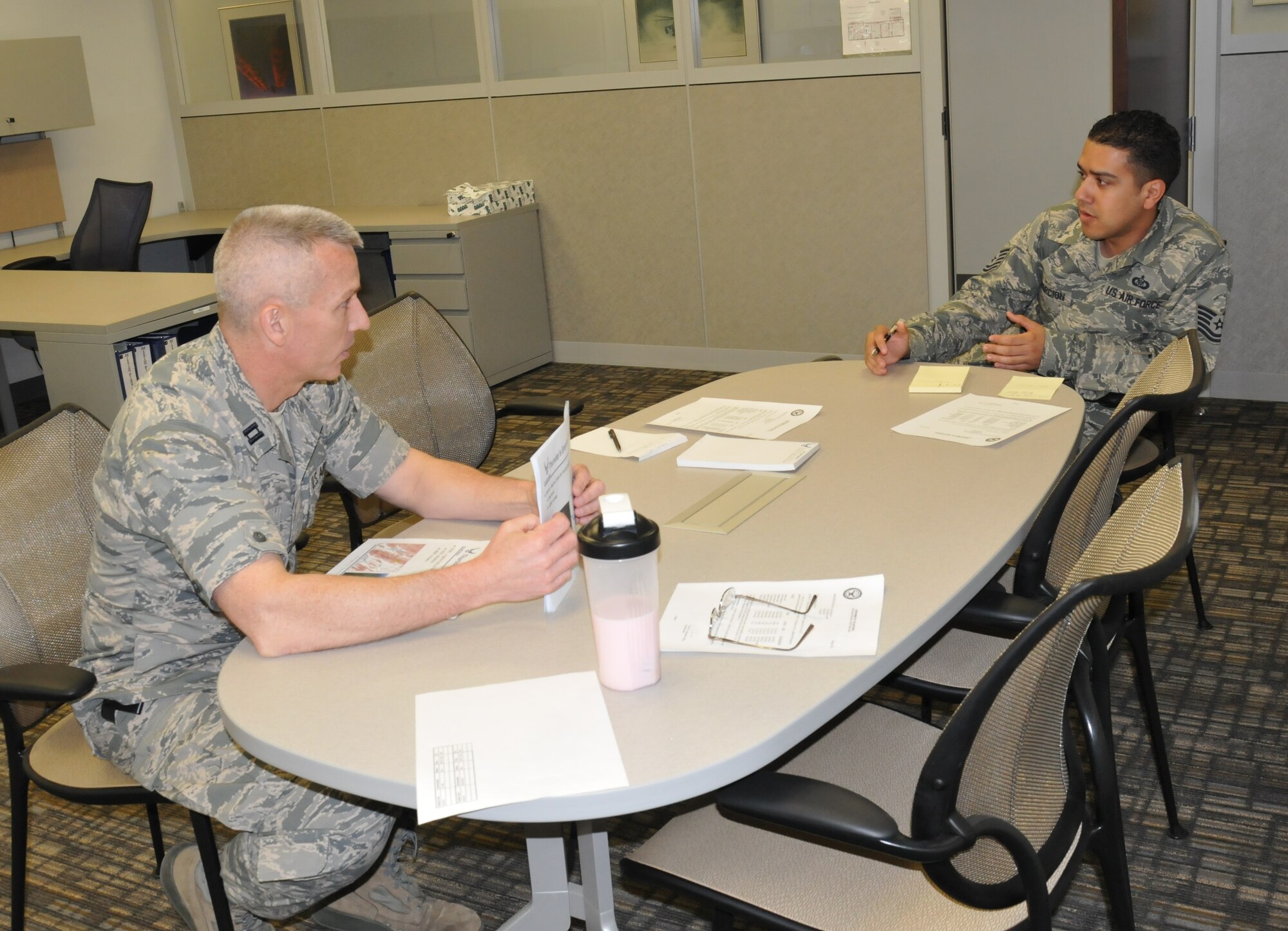 Tech. Sgt. Johnathan Concepcion (right), 512th Airlift Control Flight operations NCO, discusses a deployment readiness training exercise with Capt. John Glass, 512th ALCF operations officer, during a pre-flight briefing April 7, 2014, at Dover Air Force Base, Del. They and two other 512th ALCF reservists spent the week training alongside active-duty Airmen from Joint Base McGuire-Dix-Lakehurst, N.J., honing their skills in setting up command and control operations at Griffiss International Airport in Rome, N.Y. (U.S. Air Force photo/Senior Airman Joe Yanik)