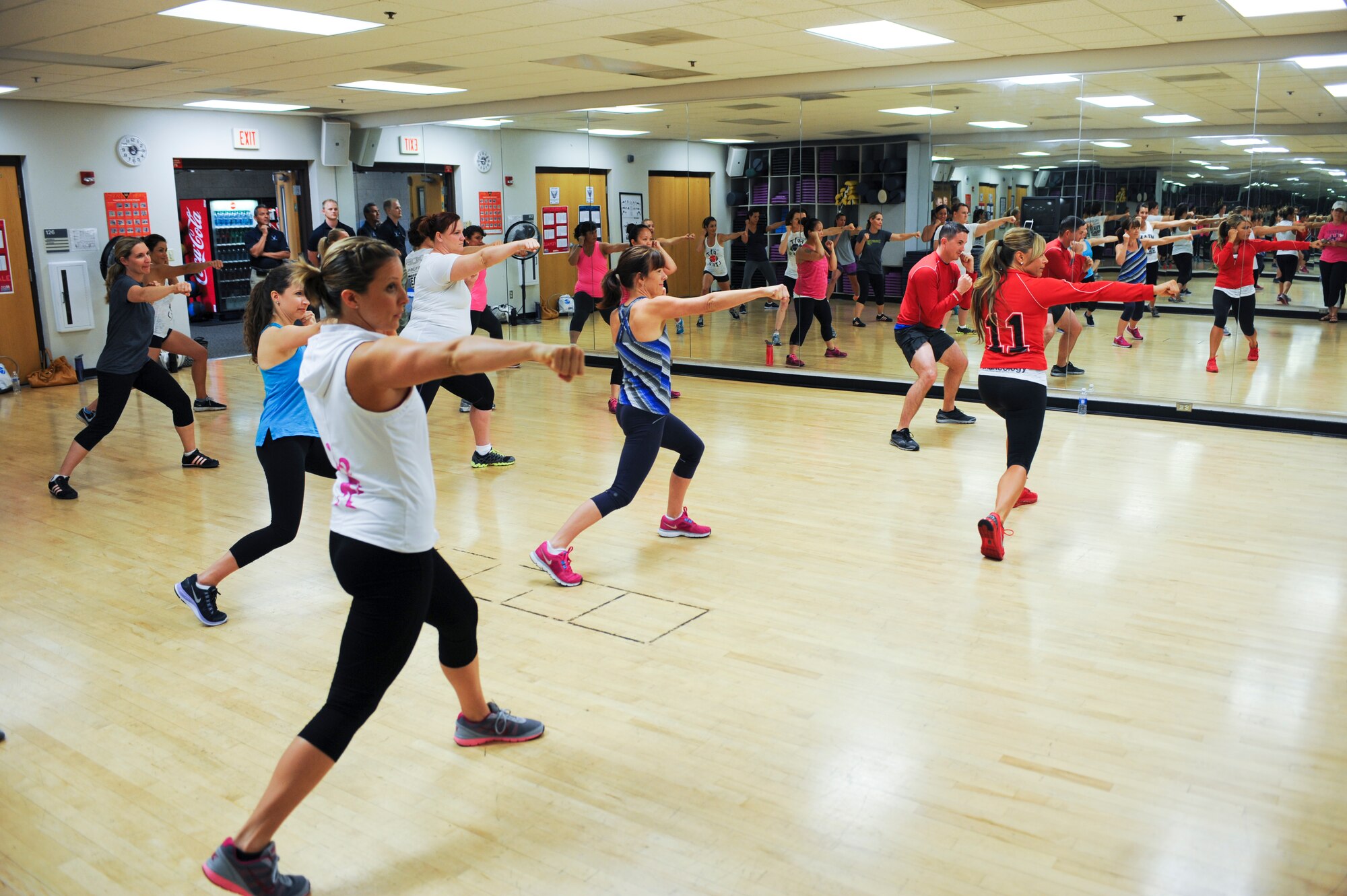 Mindy Lawhorne, Turbo Jam instructor, teaches a class during a beach body briefing and clinic at Davis-Monthan Air Force Base, Ariz., April 10, 2014. Lawhorne has been teaching Turbo Jam for more than 20 years. (U.S. Air Force photo by Senior Airman Sivan Veazie/Released)