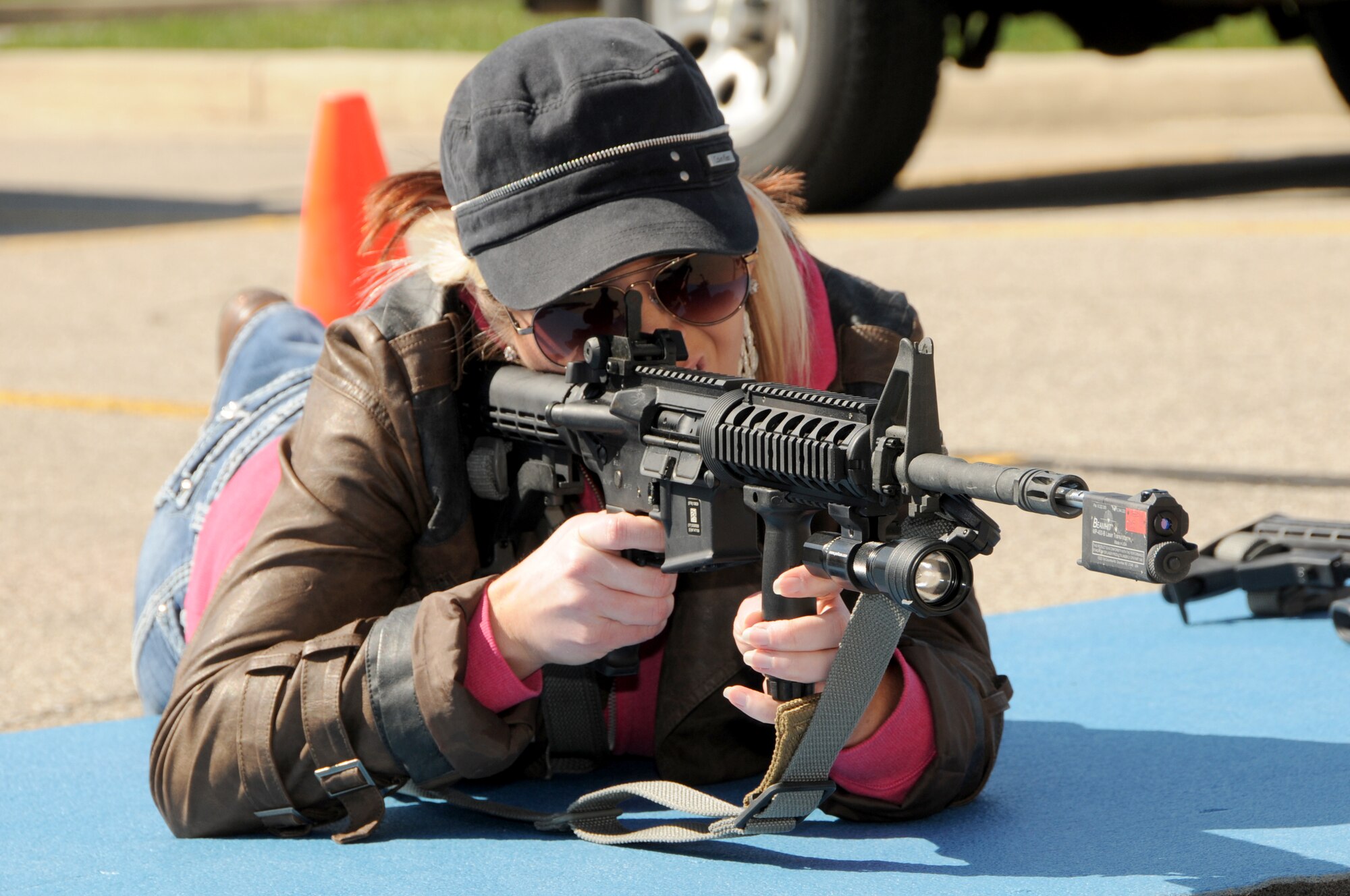 An employer takes aim with an M-4 carbine during Operation Joint Engagement at the Springfield Air National Guard Base, April 10. More than 30 employers participated and received unique hands-on experience with different equipment, weapons and a ride in a UH-60 Blackhawk helicopter. (Ohio Air National Guard photo by Senior Master Sgt. Joseph Stahl/Released)