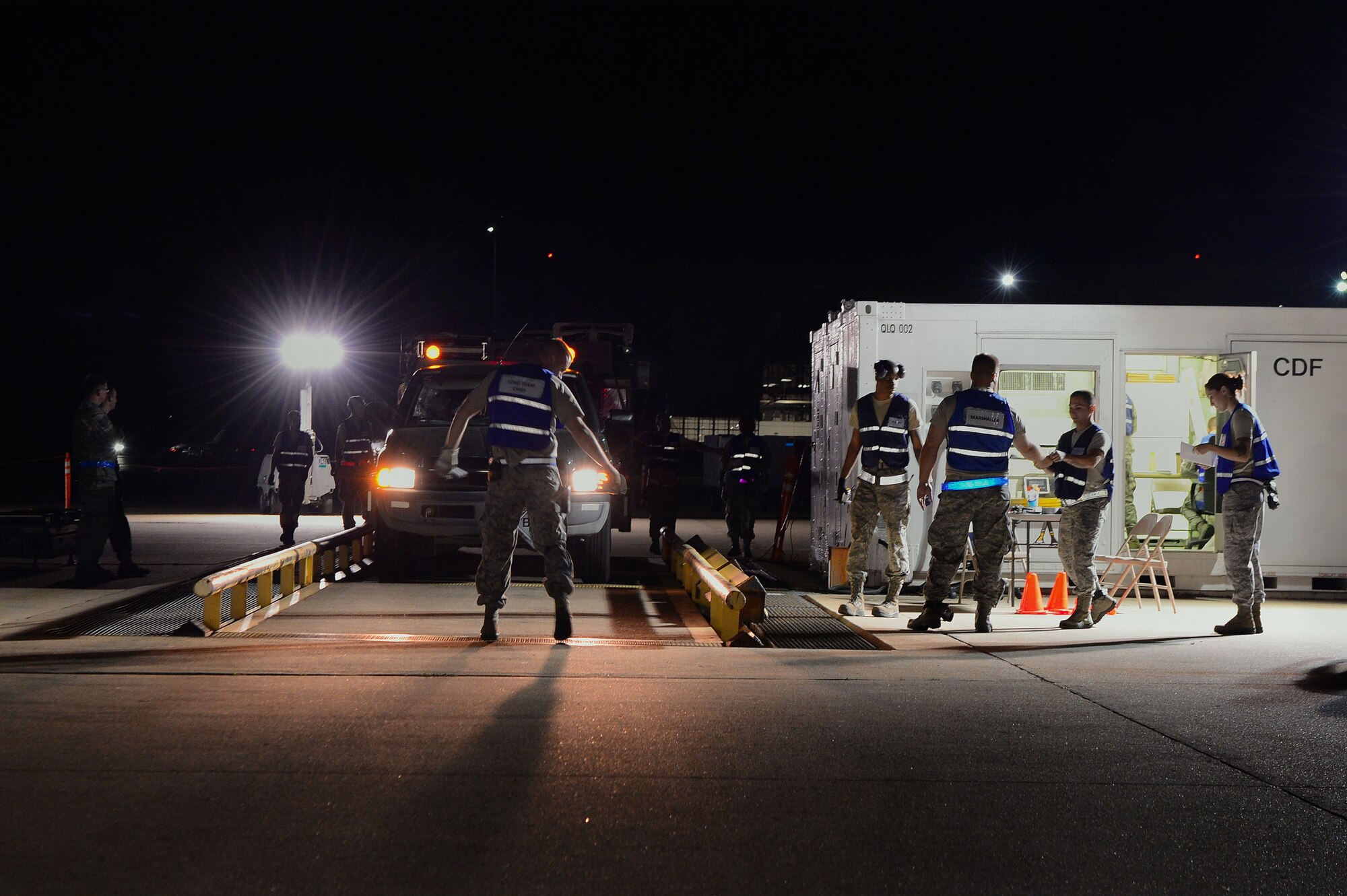 U.S. Air Force Airmen participate in Phase I of an operational readiness exercise at Shaw Air Force Base, S.C., April 10, 2014. Phase I consisted of a simulated deployment where each Airman and their gear was processed through the deployment processing center before simulating boarding an aircraft. (U.S. Air Force photo by Airman 1st Class Jensen Stidham/Released)