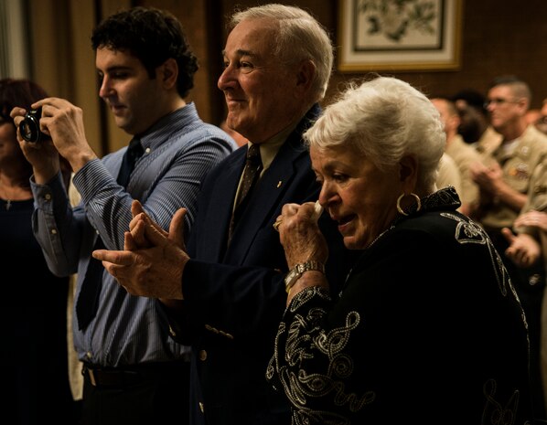 Petty Officer 3rd Class Travis Kirckof’s grandparents and brother show their emotions as Petty Officer Kirckof receives the Navy and Marine Corp Medal August 11, 2014, at Joint Base Charleston – Air Base, S.C. Kirckof received the medal for his heroic actions while serving as a Search and Rescue Swimmer on USS Guardian (MCM 5), where he helped 46 of his shipmates to safety after the Guardian ran aground on a reef in the Sulu Sea, Jan. 17, 2013. (U.S. Air Force photo/Senior Airman Dennis Sloan)