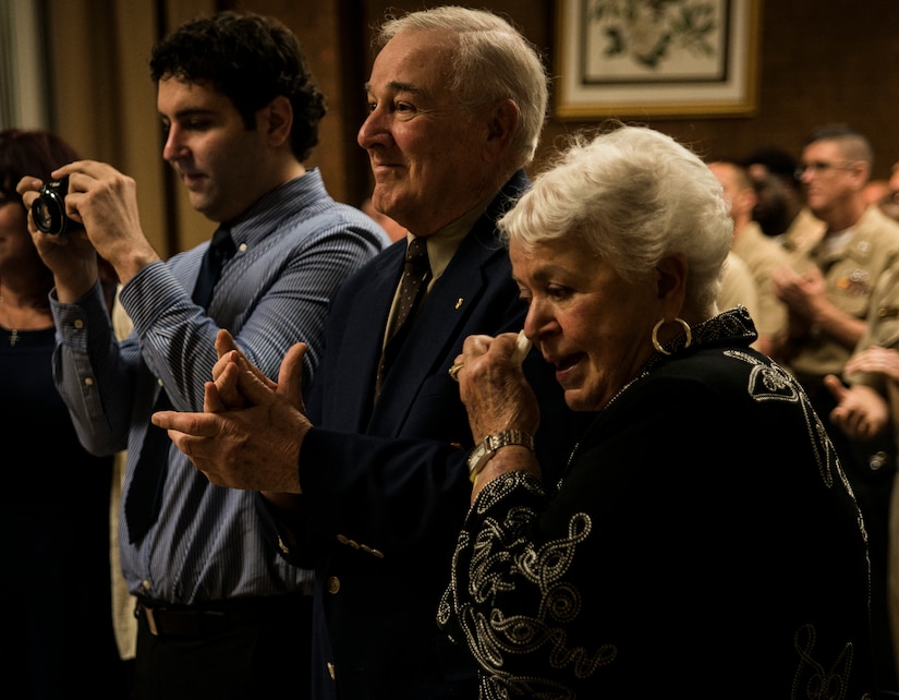 Petty Officer 3rd Class Travis Kirckof’s grandparents and brother show their emotions as Petty Officer Kirckof receives the Navy and Marine Corp Medal August 11, 2014, at Joint Base Charleston – Air Base, S.C. Kirckof received the medal for his heroic actions while serving as a Search and Rescue Swimmer on USS Guardian (MCM 5), where he helped 46 of his shipmates to safety after the Guardian ran aground on a reef in the Sulu Sea, Jan. 17, 2013. (U.S. Air Force photo/Senior Airman Dennis Sloan)