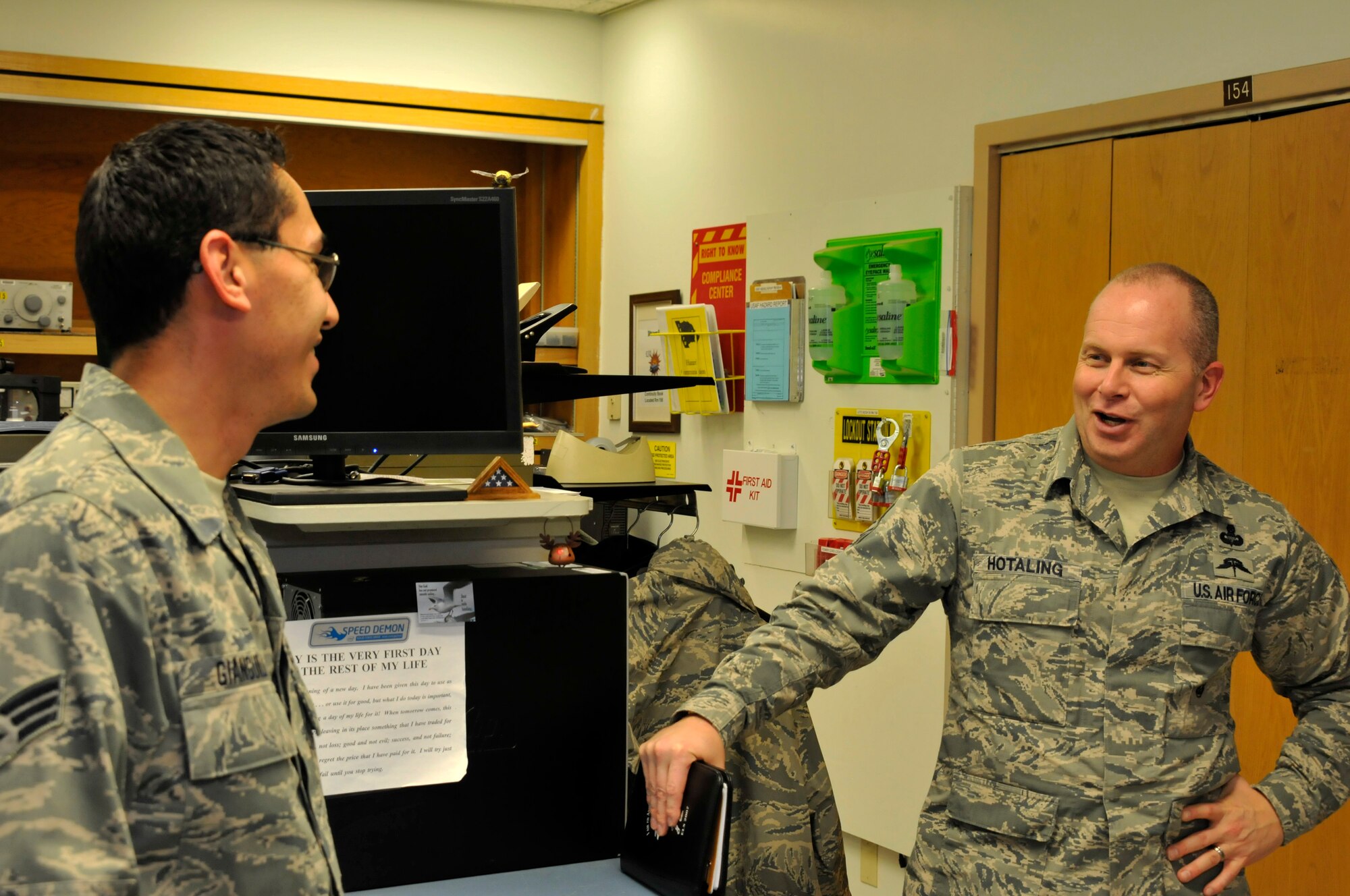 Air National Guard Command Chief Master Sgt. James W. Hotaling speaks with Senior Airman John Gianguilli at Ebbing Air National Guard Base, Fort Smith, Ark., April 5, 2014. Hotaling visited with many Airmen during his time at the 188th Fighter Wing. He also met with wing leadership before touring the unit’s facilities.  (U.S. Air National Guard photo by Airman 1st Class Cody Martin/Released)