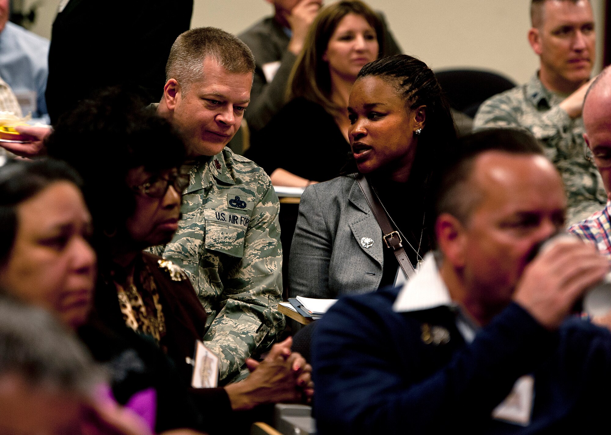 Maj. Brian Greania, 860th Aircraft Maintenance Squadron commander, answers questions for his Honorary Commander Shemila Johnson during a briefing at the Airman Leadership School as part of the Honorary Commander Boot Camp, April 3. (U.S. Air Force photo/Tech. Sgt. Matthew Hannen)