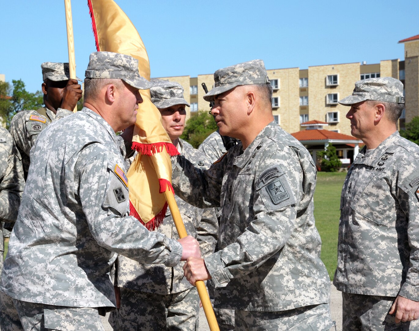 Army Lt. Gen. David D. Halverson (left) accepts the colors from Army Gen. John F. Campbell (center), Vice Chief of Staff of the Army, and assumes duties as commanding general of the U.S. Army Installation Management Command and Assistant Chief of Staff for Installation Management as outgoing IMCOM commander Lt. Gen. Mike Ferriter (right) looks on during a change of command ceremony at Joint Base San Antonio-Fort Sam Houston’s MacArthur Parade Field Tuesday. Halverson served as deputy commanding general for the Army Training and Doctrine Command at Fort Eustis, Va., before this assignment. An article and additional photos from the change of command will appear in the April 18 edition of the News Leader.

Photo by Joel Martinez