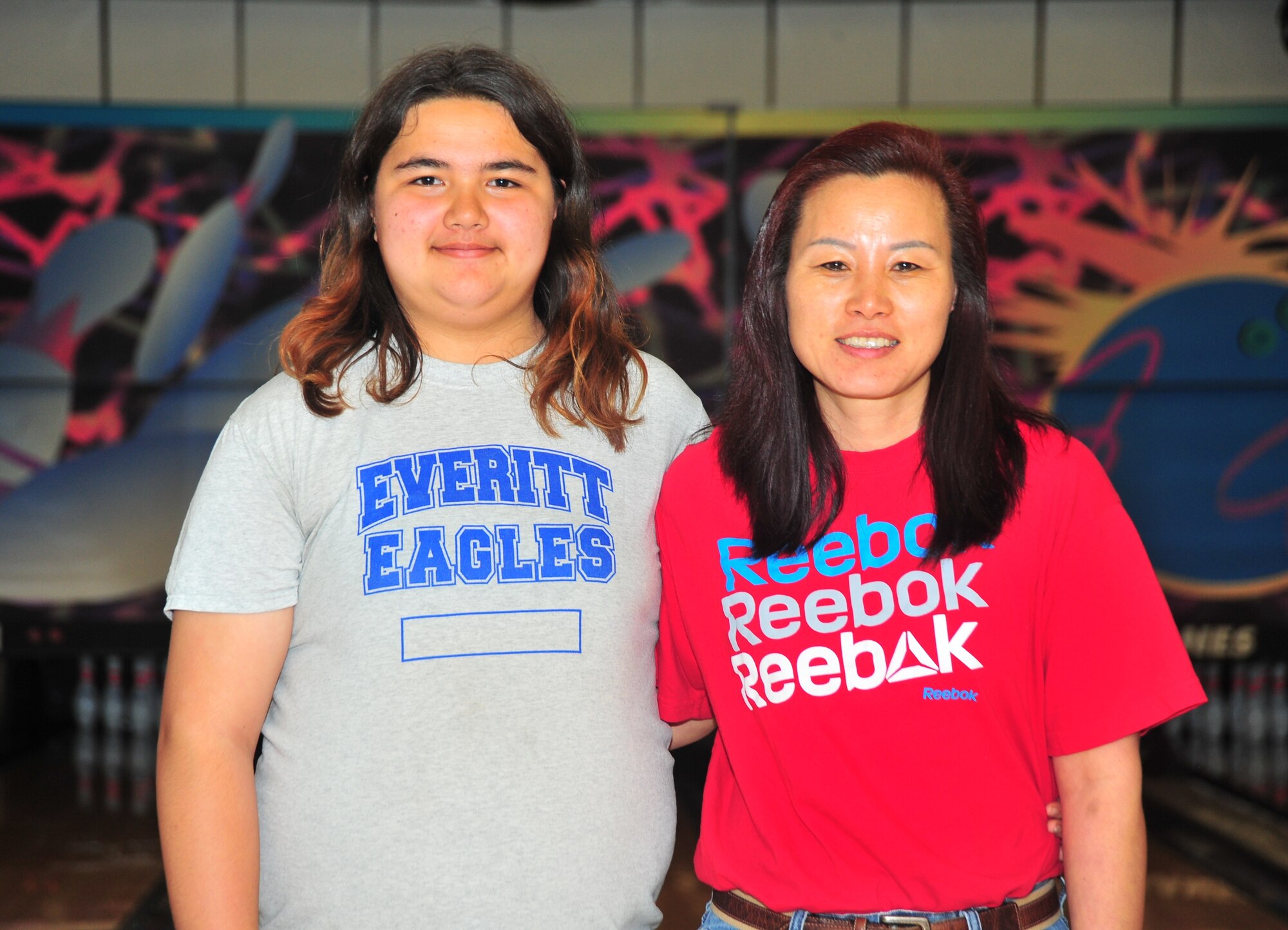 From left to right: Rebecca “Boo” Dodson, Everitt Middle School student, and Chong Dodson, mother of “Boo” pose for a photo April 9 at Tyndall’s Raptor Lanes. “Boo” bowled a perfect score of 300 during a singles bowling event April 6. (U.S. Air Force photo by Airman 1st Class Sergio A. Gamboa)