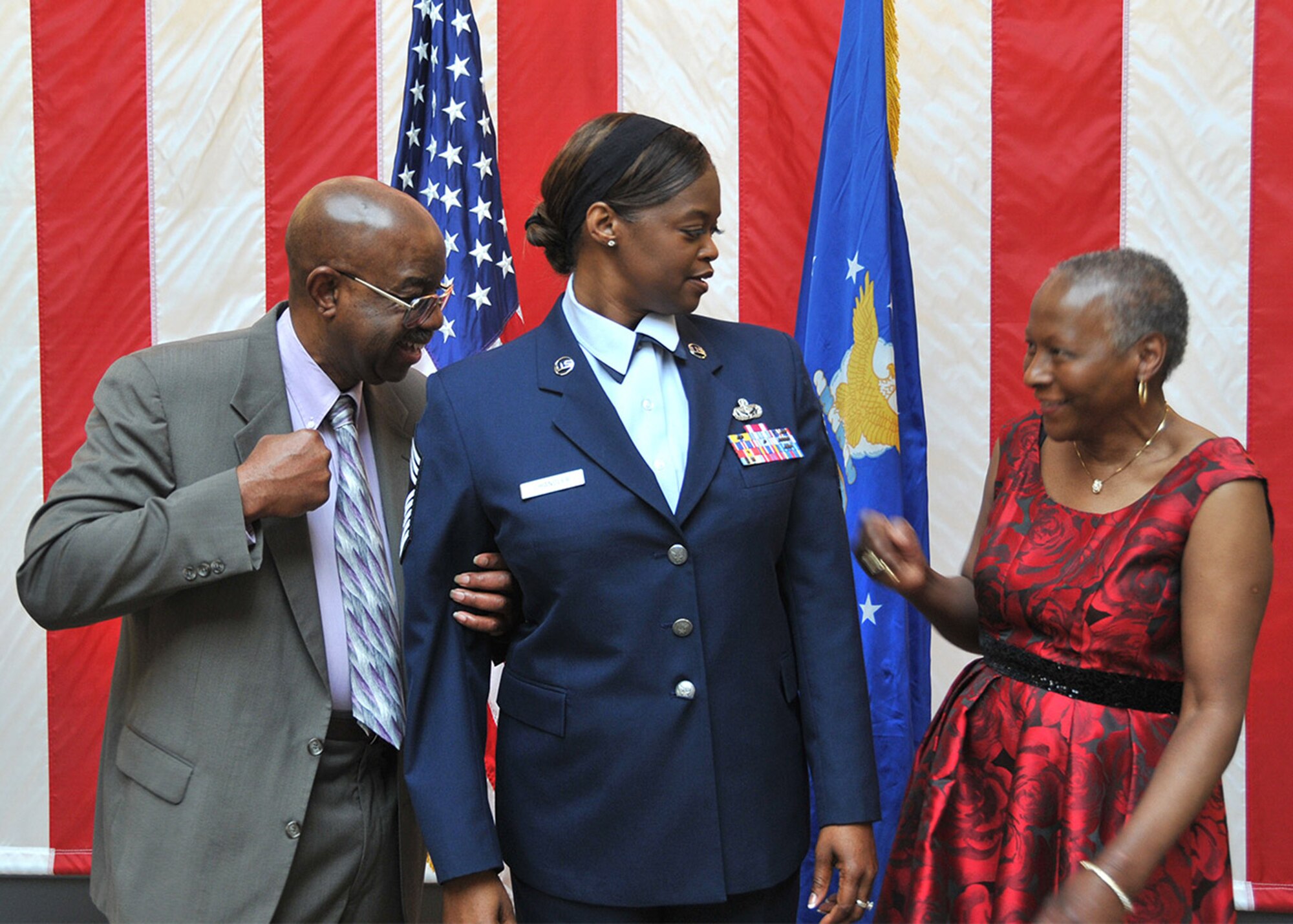 Chief Master Sgt. Aretha Chandler braces in preparation of her parents “pinning-on” her chief stripes during Chandler’s promotion ceremony held here during April’s A flight.  Chandler, the 349th Memorial Affairs Squadron superintendent, joined the ranks of the chiefs after more than 21 years in various positions within the 349th Air Mobility Wing.