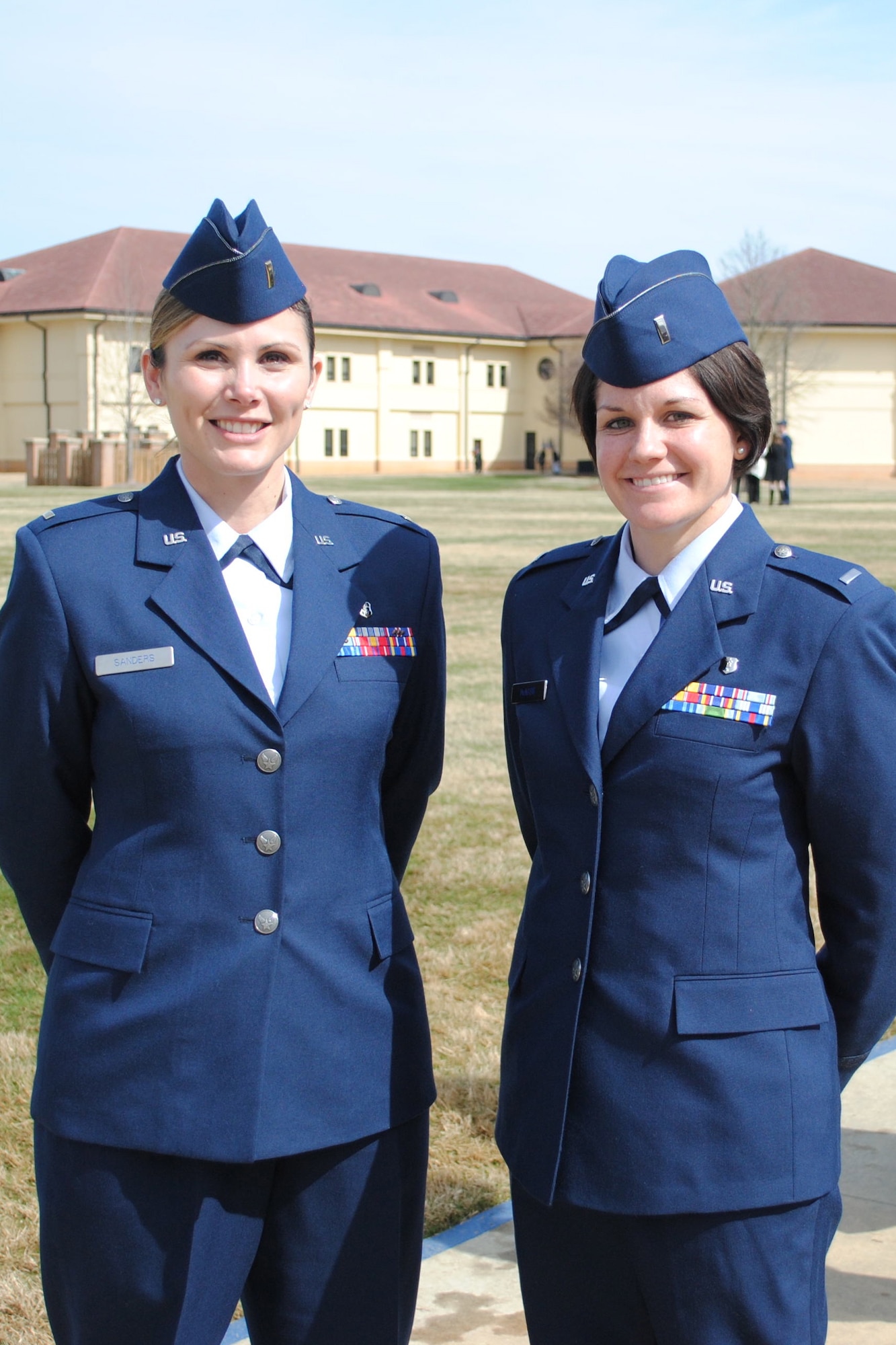 1st Lt. Morgan McNabb, 341st Medical Operations Squadron staff social worker (right), poses for a photo with a classmate after graduating from Commissioned Officer Training School in February. McNabb served as an enlisted Airman from 2001 to 2005 before pursuing a master’s degree in social work to commission as an officer. (Courtesy photo)