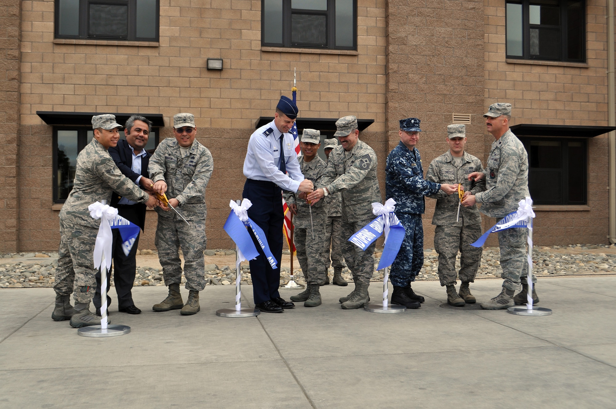TRAVIS AIR FORCE BASE, Calif. -- Team Travis leadership was on-hand for the ribbon cutting ceremony for the new "Dorms-4-Airmen" opening. (U.S. Air Force photos / Ellen Hatfield)