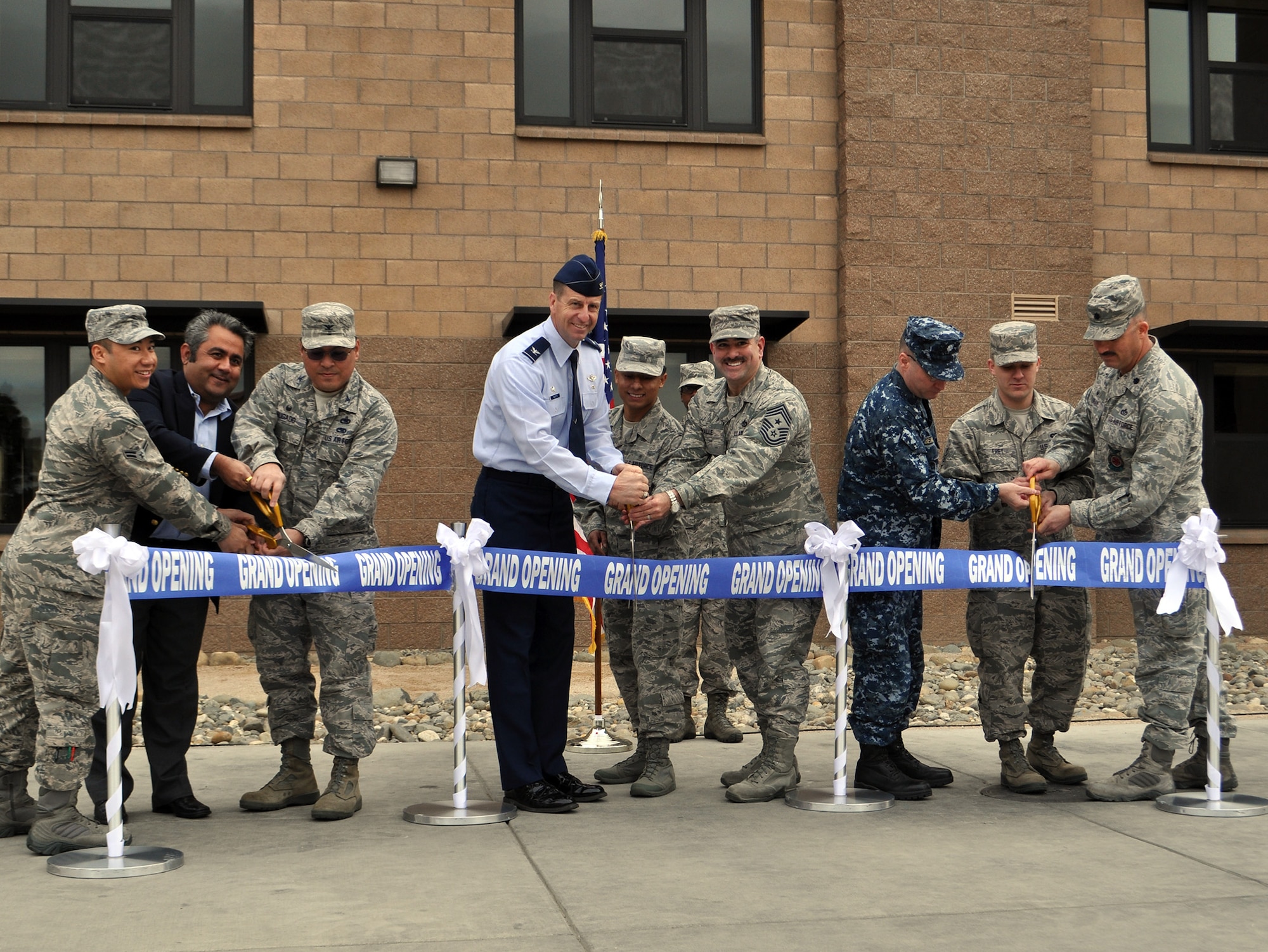 TRAVIS AIR FORCE BASE, Calif. -- Team Travis leadership was on-hand for the ribbon cutting ceremony for the new "Dorms-4-Airmen" opening. (U.S. Air Force photos / Ellen Hatfield)